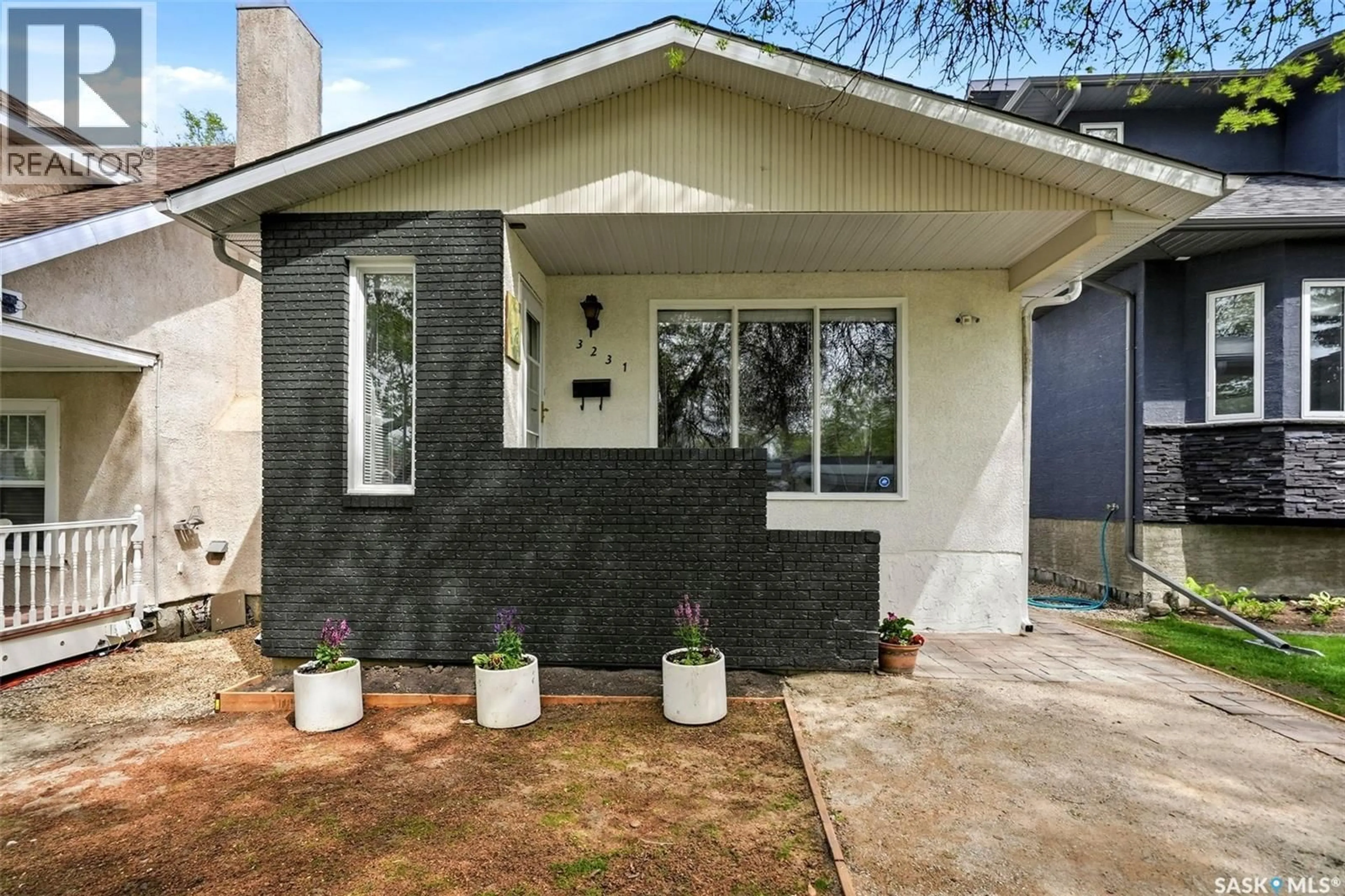 Home with vinyl exterior material, street for 3231 RETALLACK STREET, Regina Saskatchewan S4S1T7