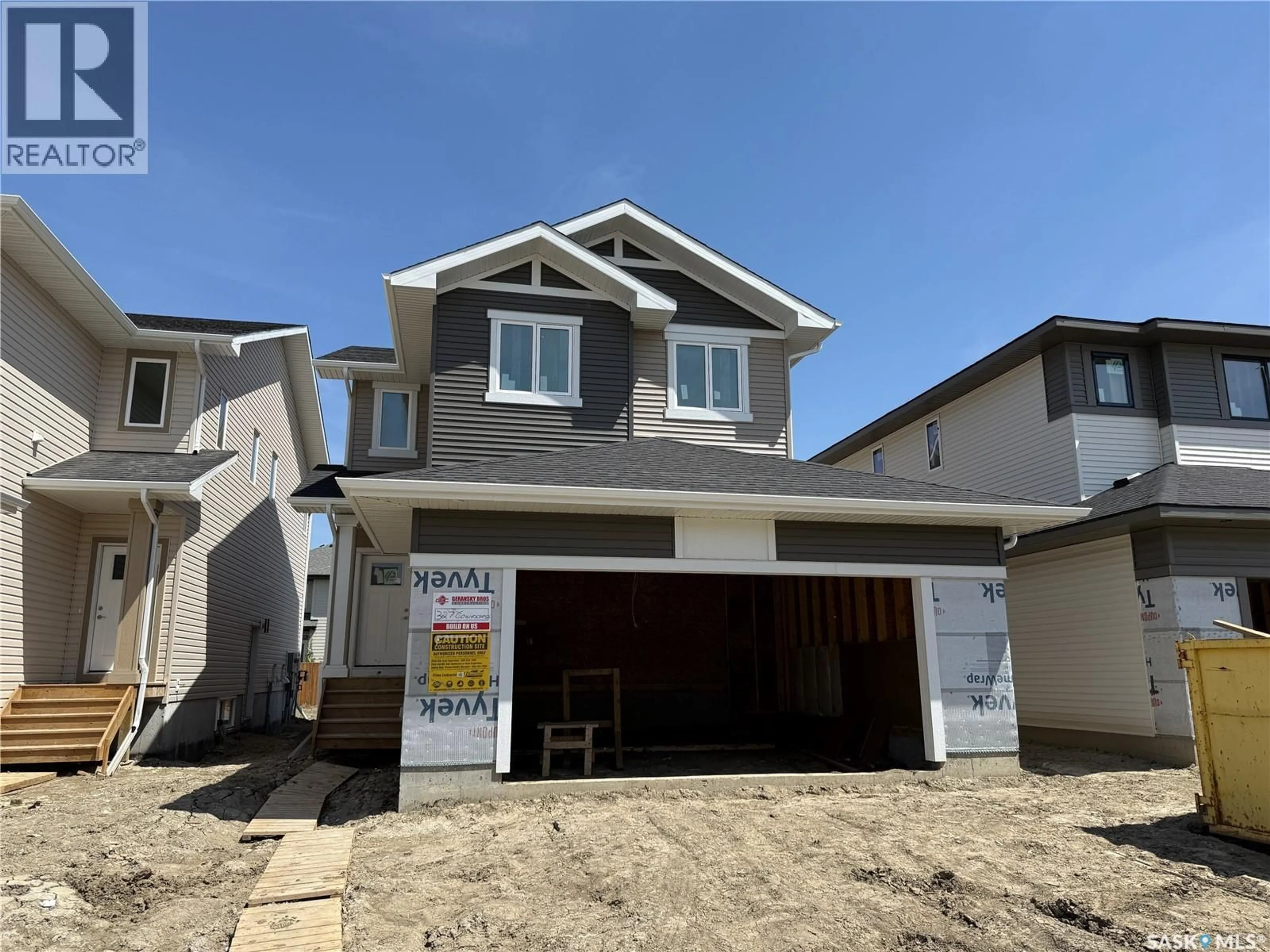 Home with vinyl exterior material, street for 327 COWESSESS ROAD, Saskatoon Saskatchewan S7V1Y4