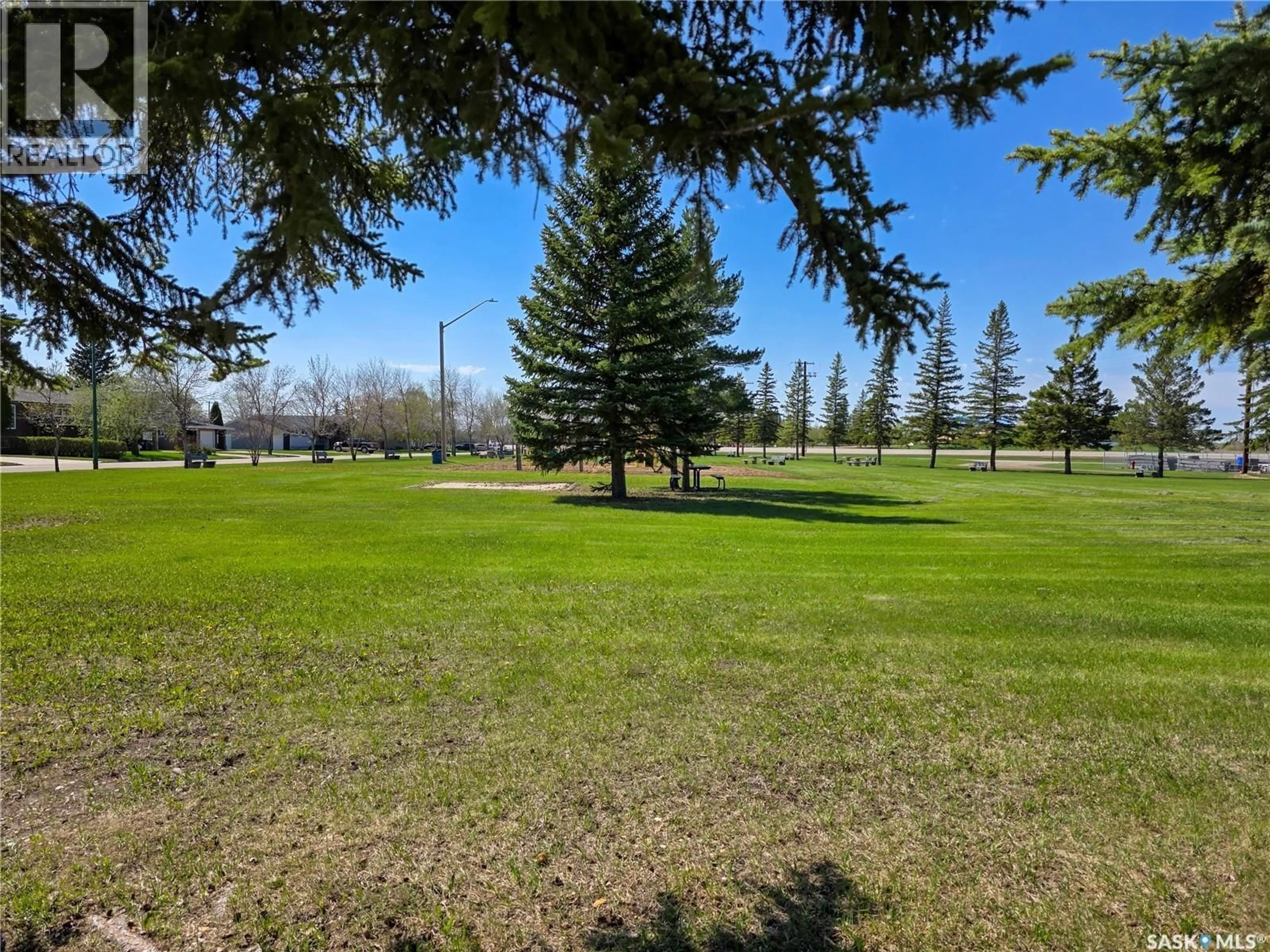 A pic from outside/outdoor area/front of a property/back of a property/a pic from drone, forest/trees view for 691 10TH AVENUE, Melville Saskatchewan S0A2P0