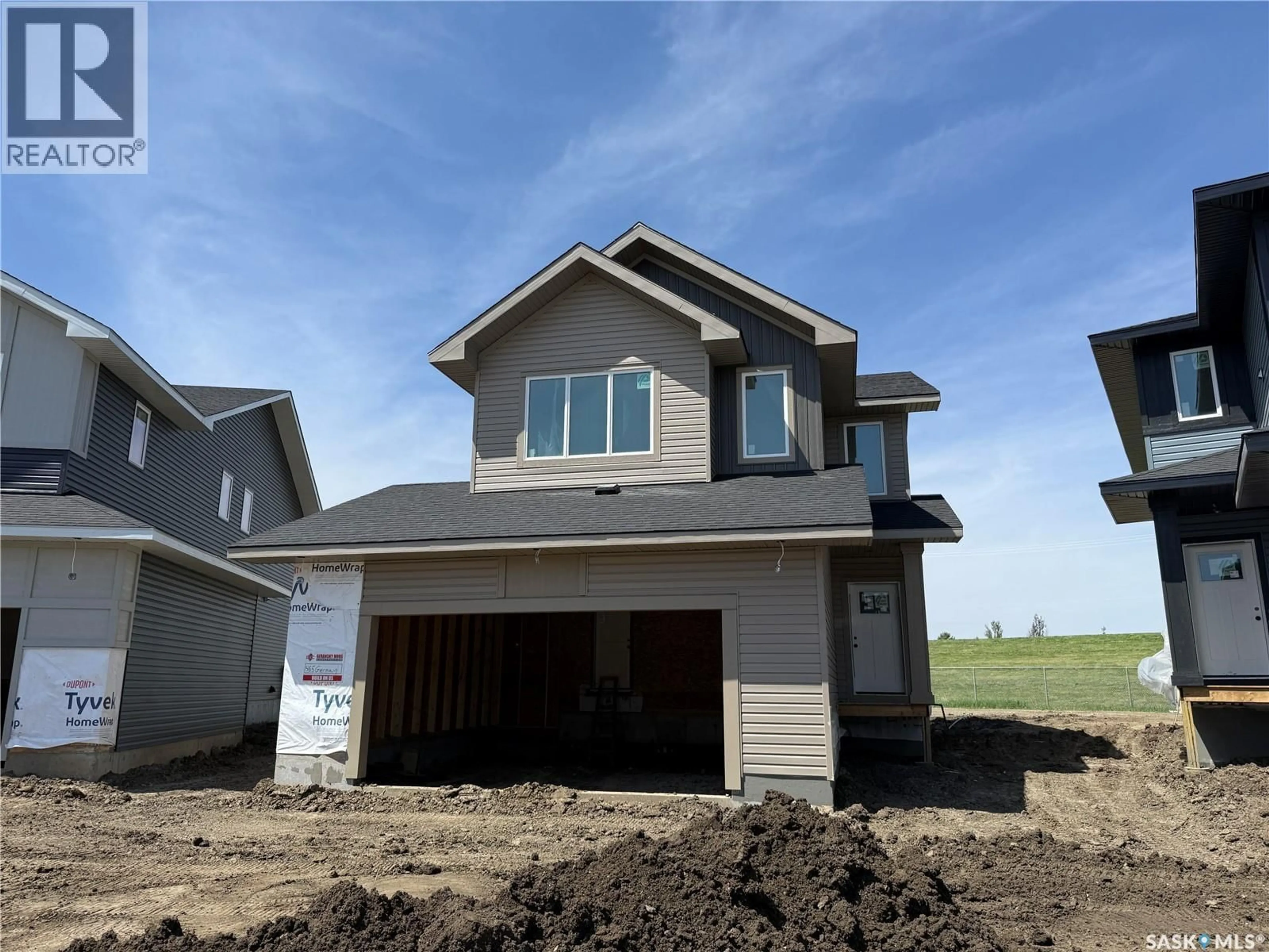Home with vinyl exterior material, street for 465 GERMAIN MANOR, Saskatoon Saskatchewan S7V0T9