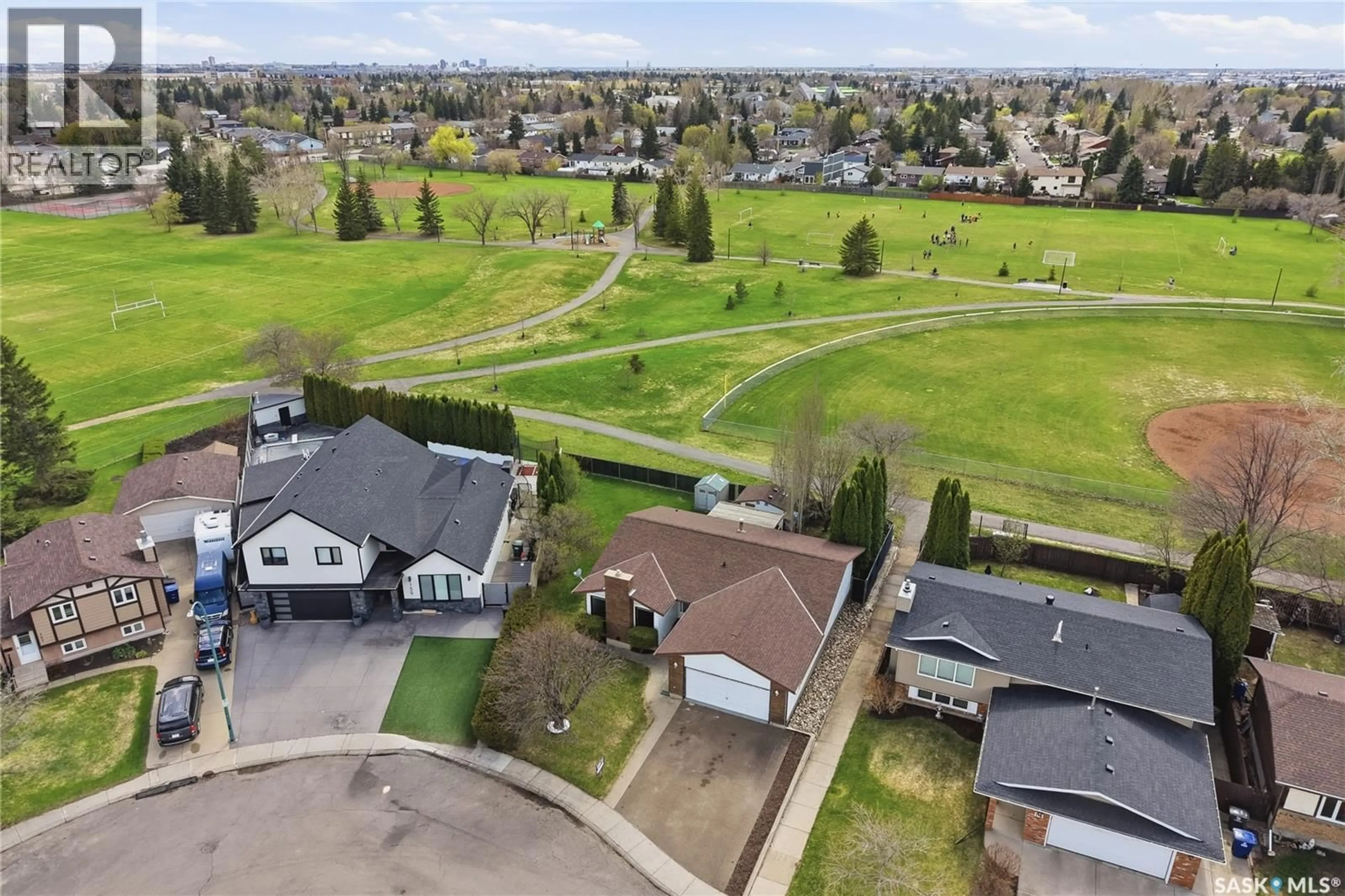 A pic from outside/outdoor area/front of a property/back of a property/a pic from drone, unknown for 155 J.J. THIESSEN CRESCENT, Saskatoon Saskatchewan S7K5N9