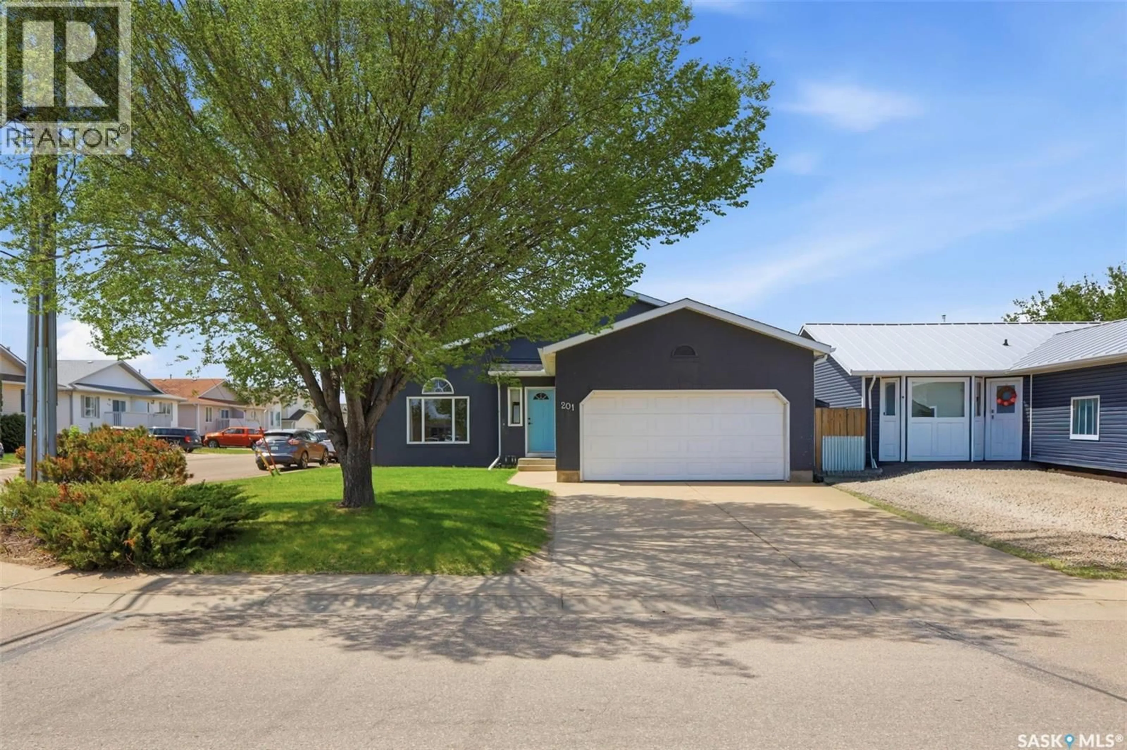 Home with vinyl exterior material, street for 201 1ST AVENUE, Warman Saskatchewan S0K4S0
