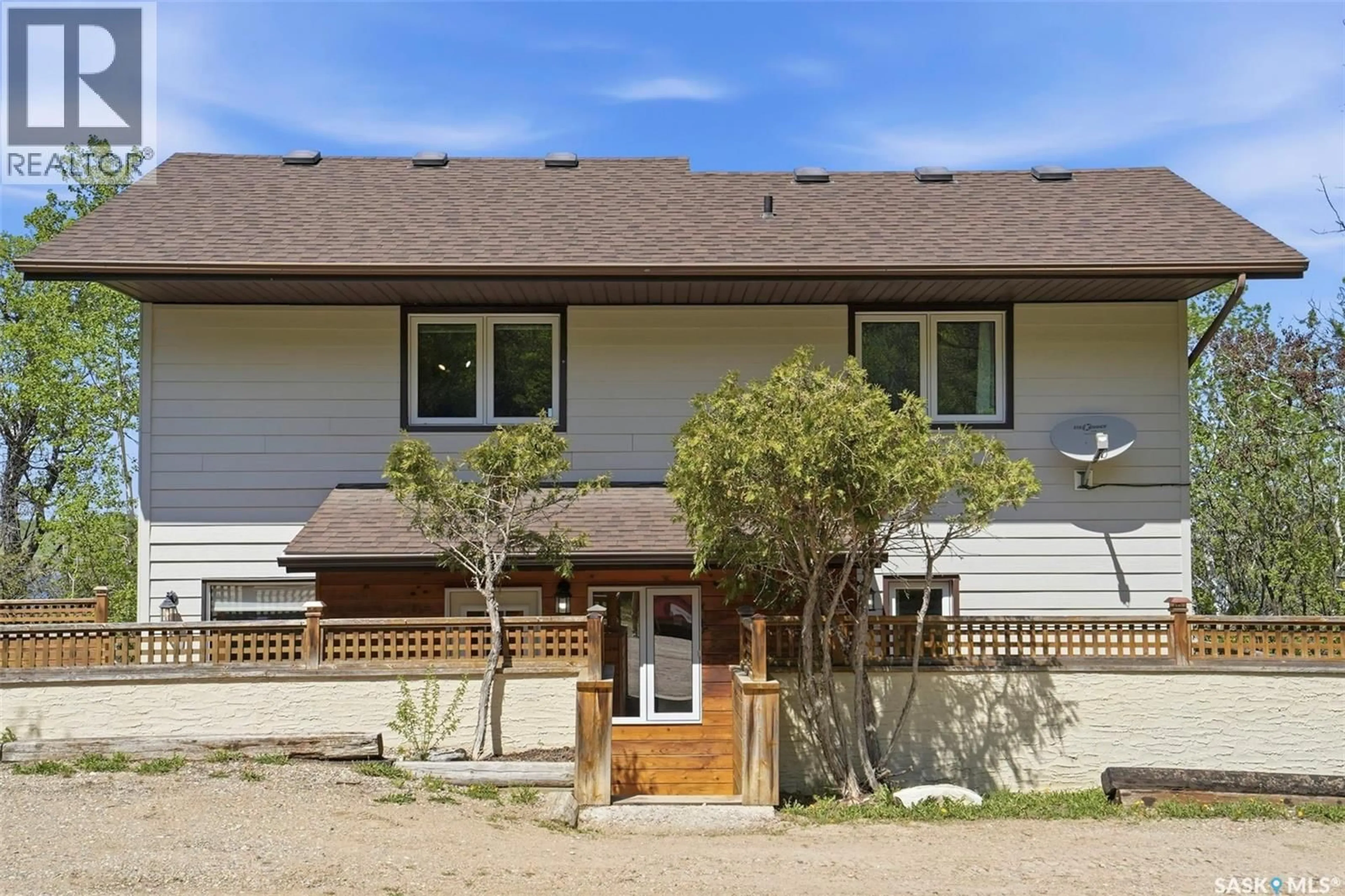 Home with vinyl exterior material, street for 818 PUKWANA DRIVE, Manitou Beach Saskatchewan S0K4T1