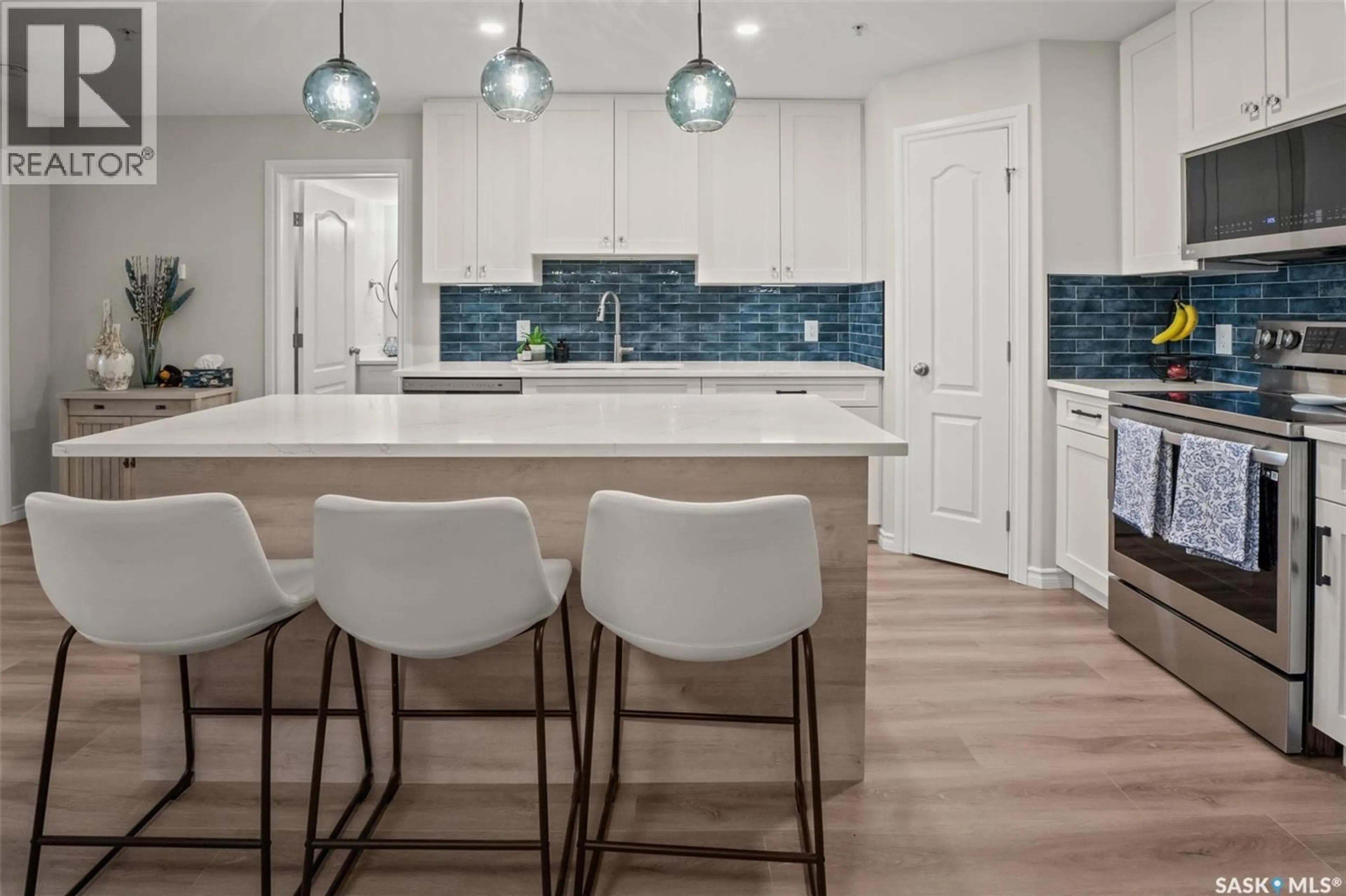 Open concept kitchen, ceramic/tile floor for 100 - 105 1ST AVENUE, Warman Saskatchewan S0K0A1