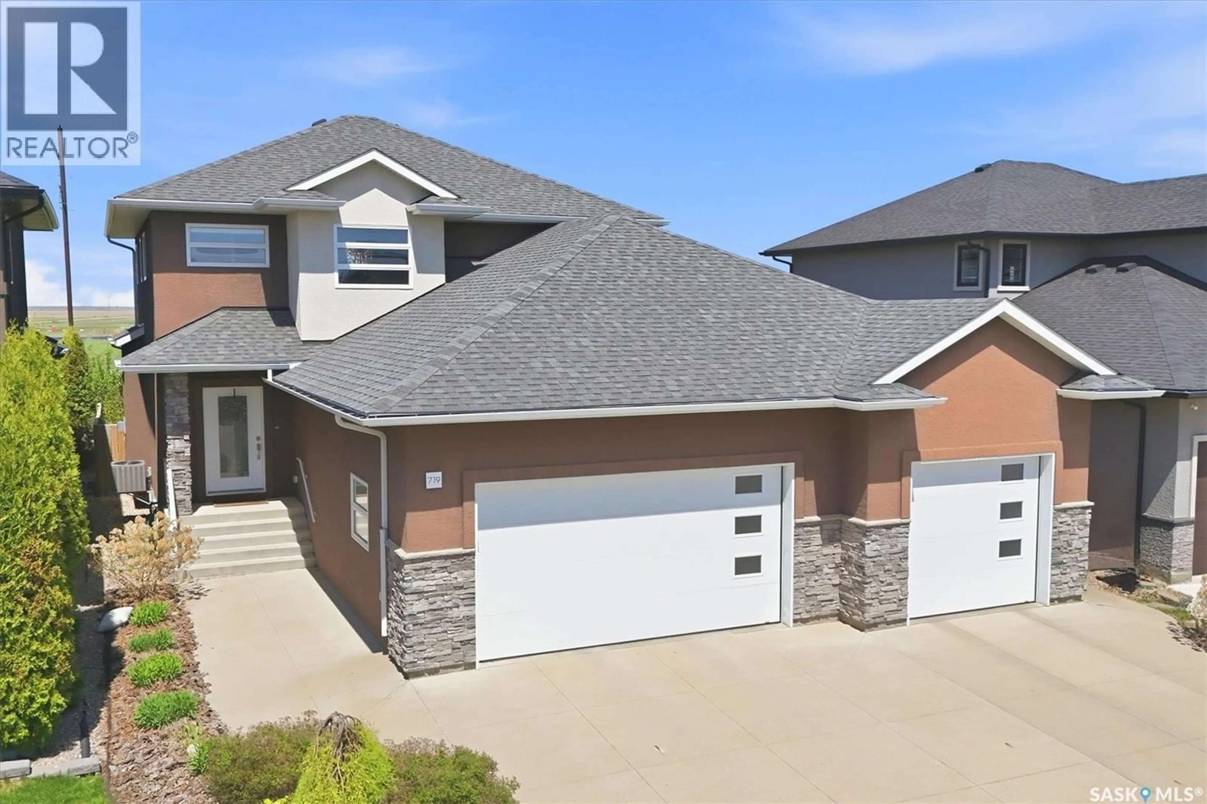 Home with brick exterior material, street for 719 SALLOUM CRESCENT, Saskatoon Saskatchewan S7W0N3