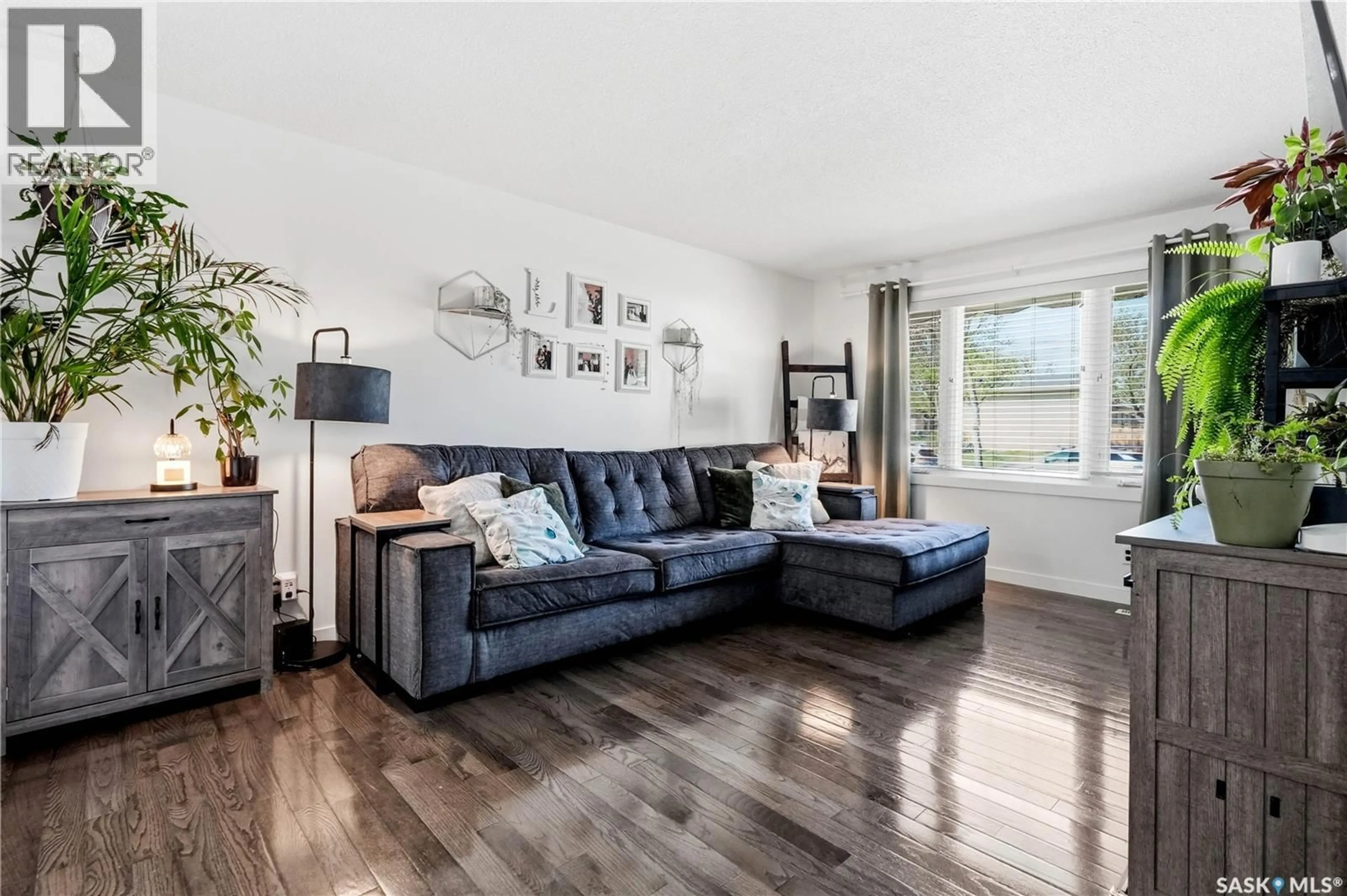 Living room with furniture, wood/laminate floor for 267 UPLAND DRIVE, Regina Saskatchewan S4R5H5