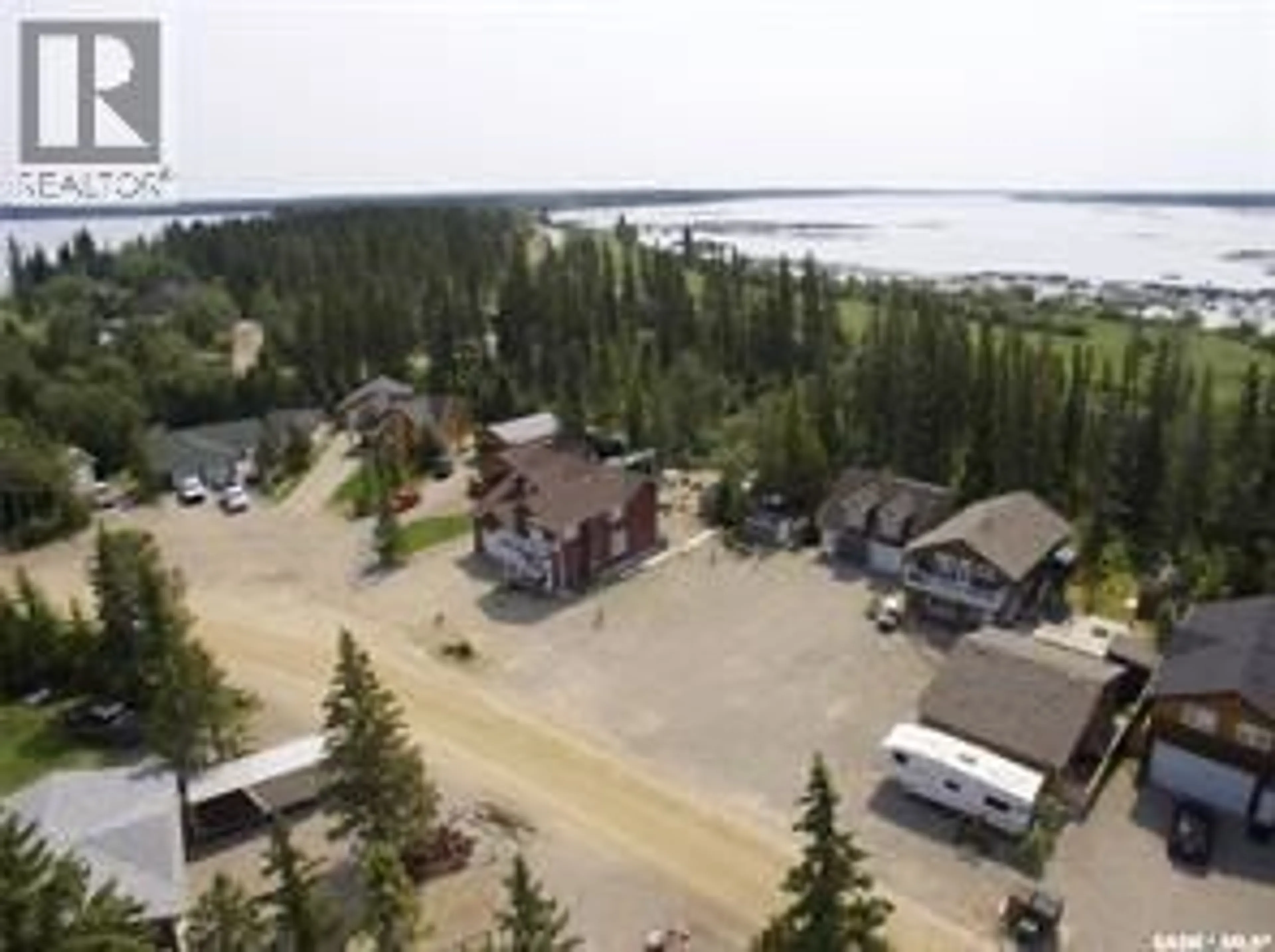 A pic from outside/outdoor area/front of a property/back of a property/a pic from drone, water/lake/river/ocean view for 20 NIPEW PLACE, Candle Lake Saskatchewan S0J3E0