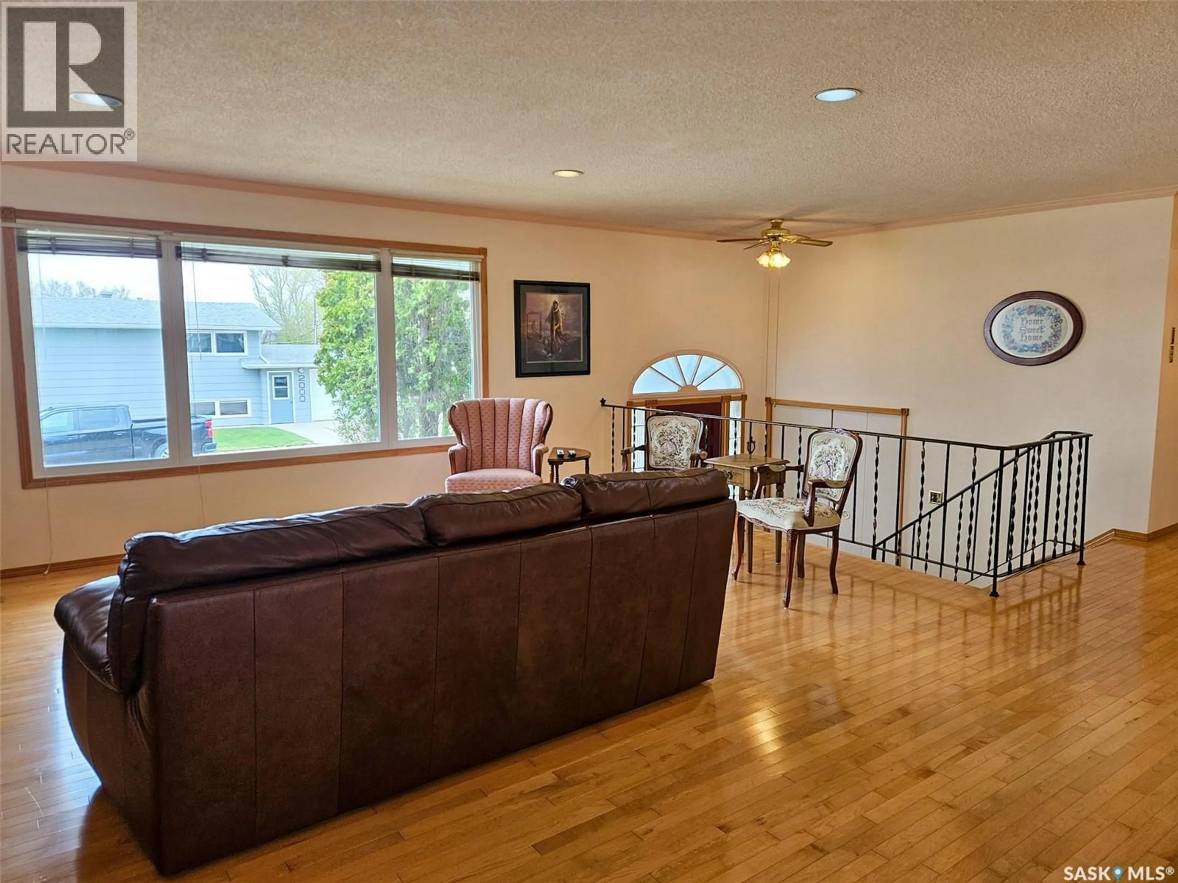 Living room with furniture, wood/laminate floor for 720 WHYTE AVENUE, Swift Current Saskatchewan S9H1P7