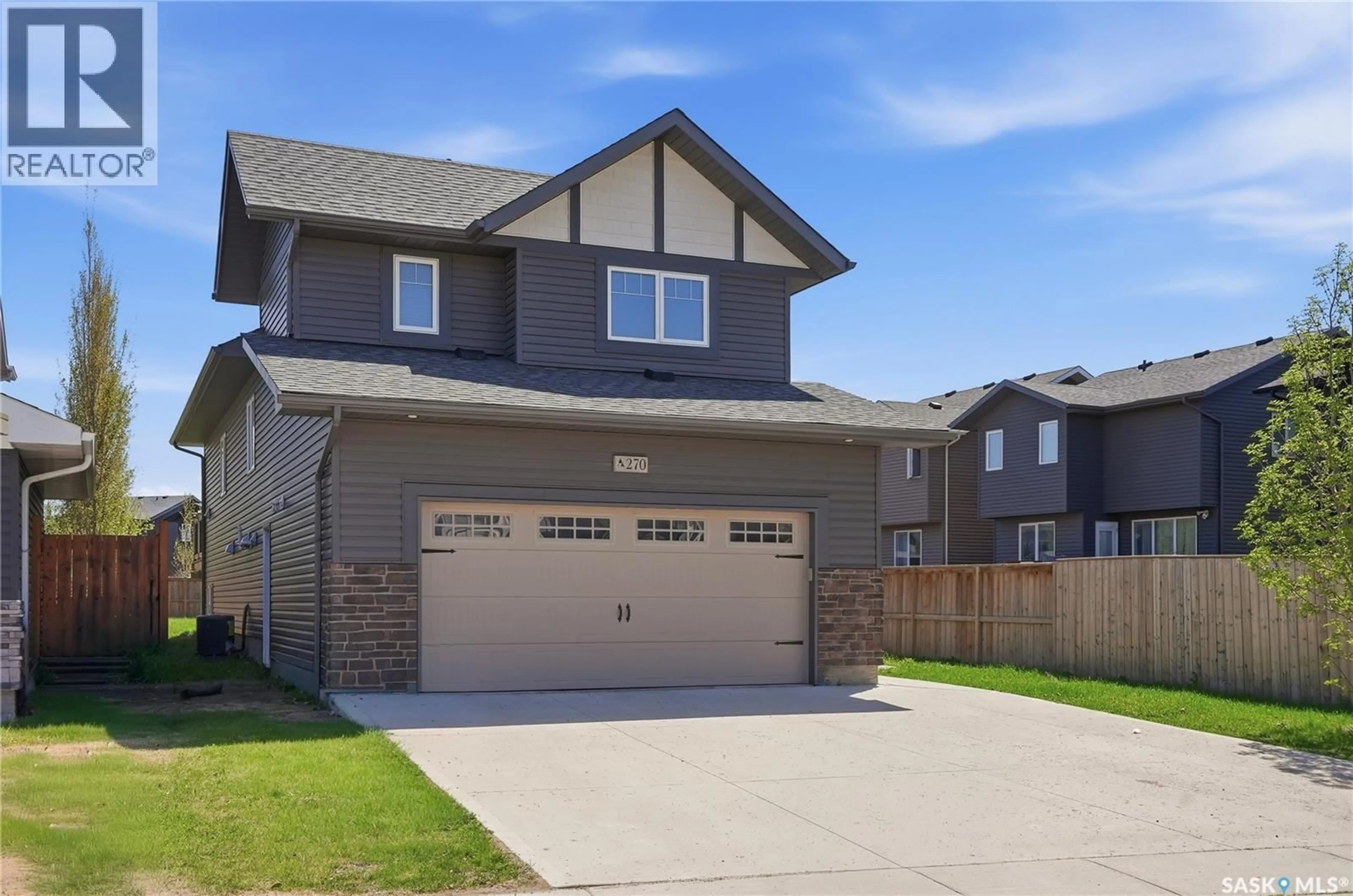 Home with vinyl exterior material, street for 270 NEWTON LINK, Saskatoon Saskatchewan S7V0M8