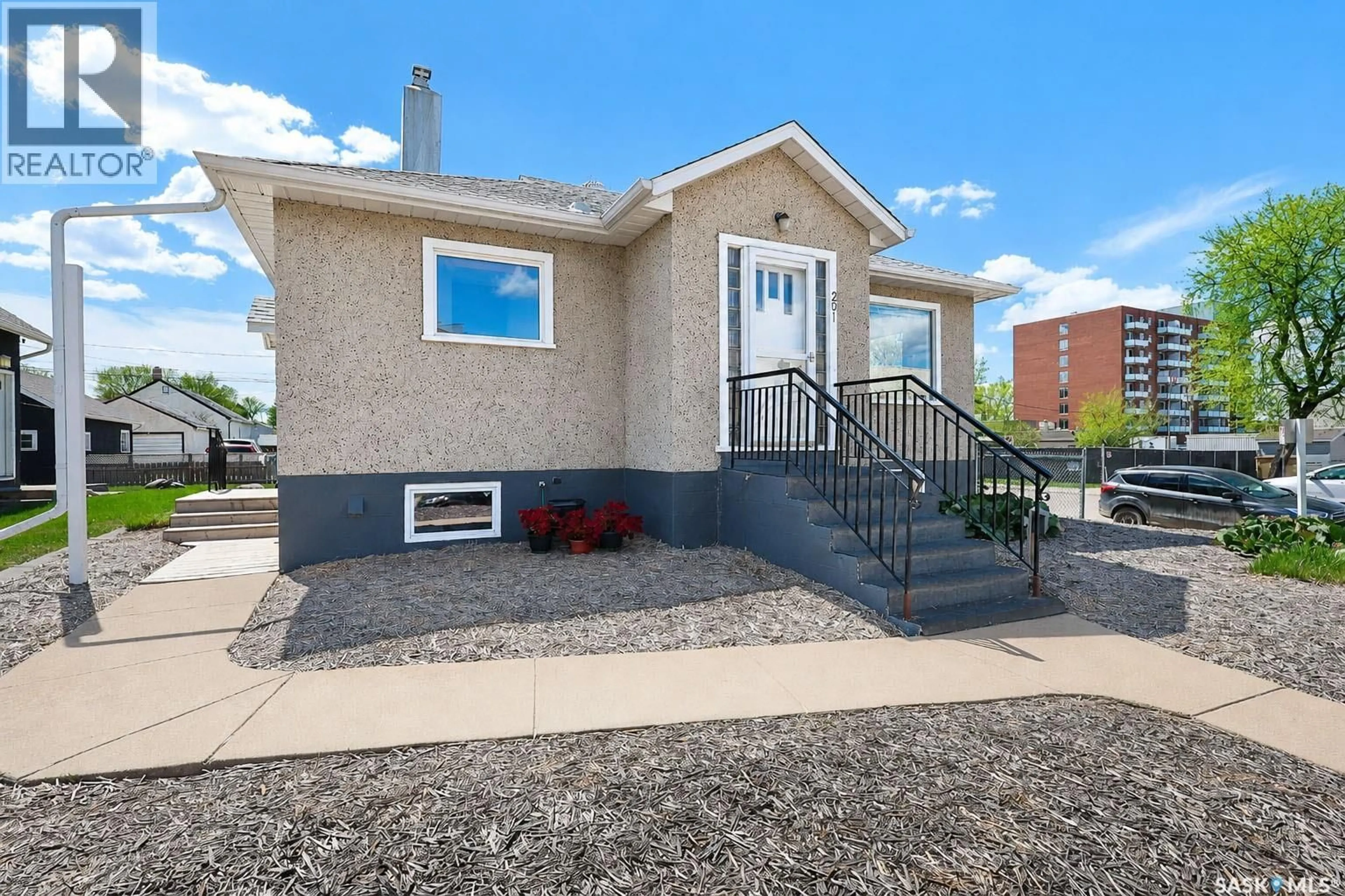 Home with vinyl exterior material, street for 201 8TH STREET, Prince Albert Saskatchewan S6V0V9