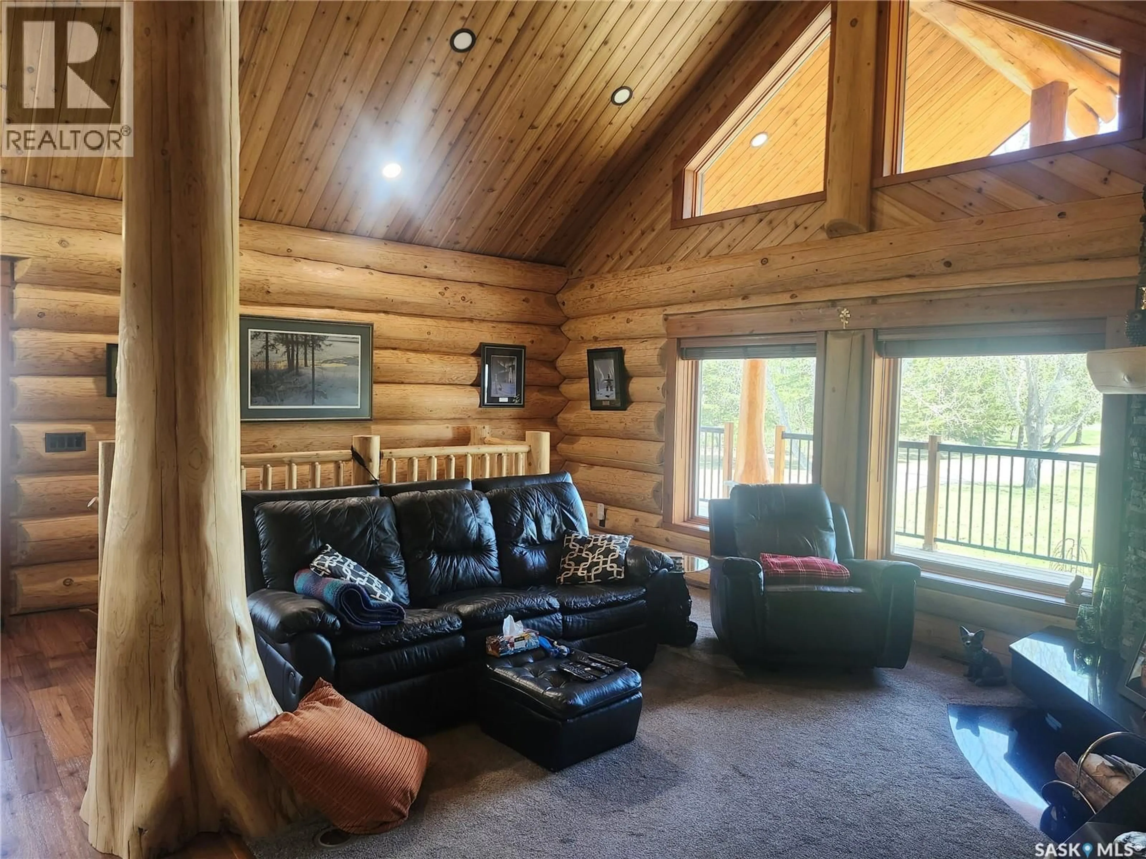 Living room with furniture, wood/laminate floor for PASKARUK ACREAGE, Paddockwood Rm No. 520 Saskatchewan S0J1Z0