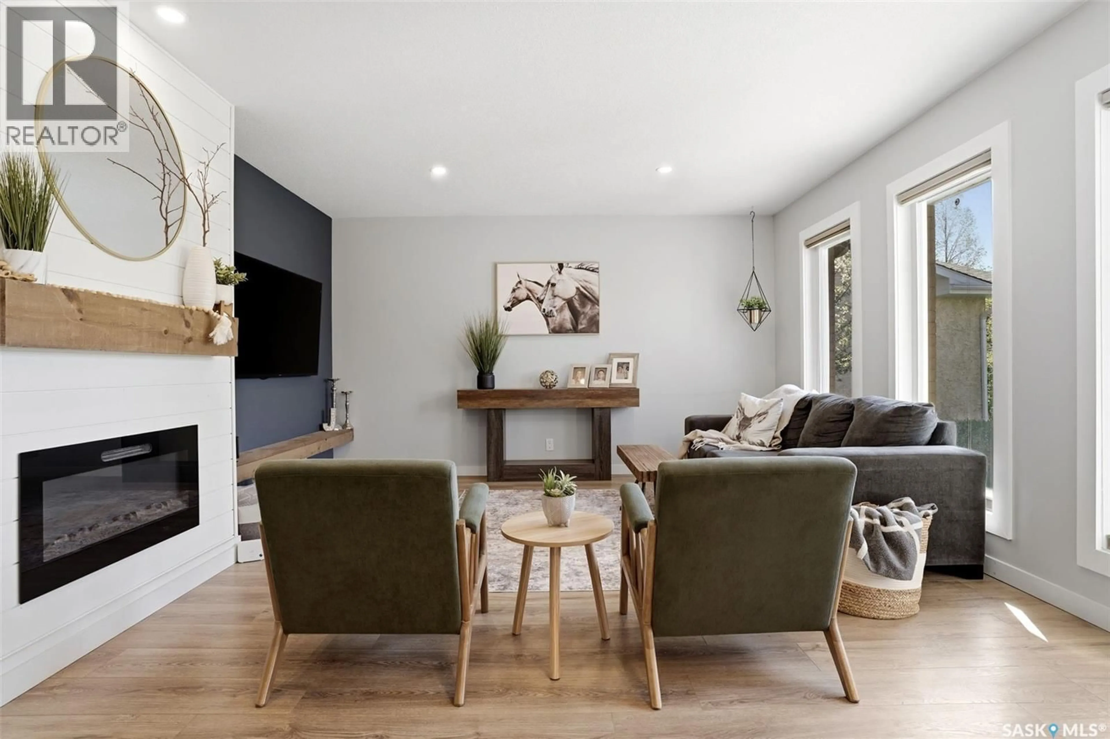 Living room with furniture, wood/laminate floor for 10 LOUISE CRESCENT, Regina Saskatchewan S4X2E2