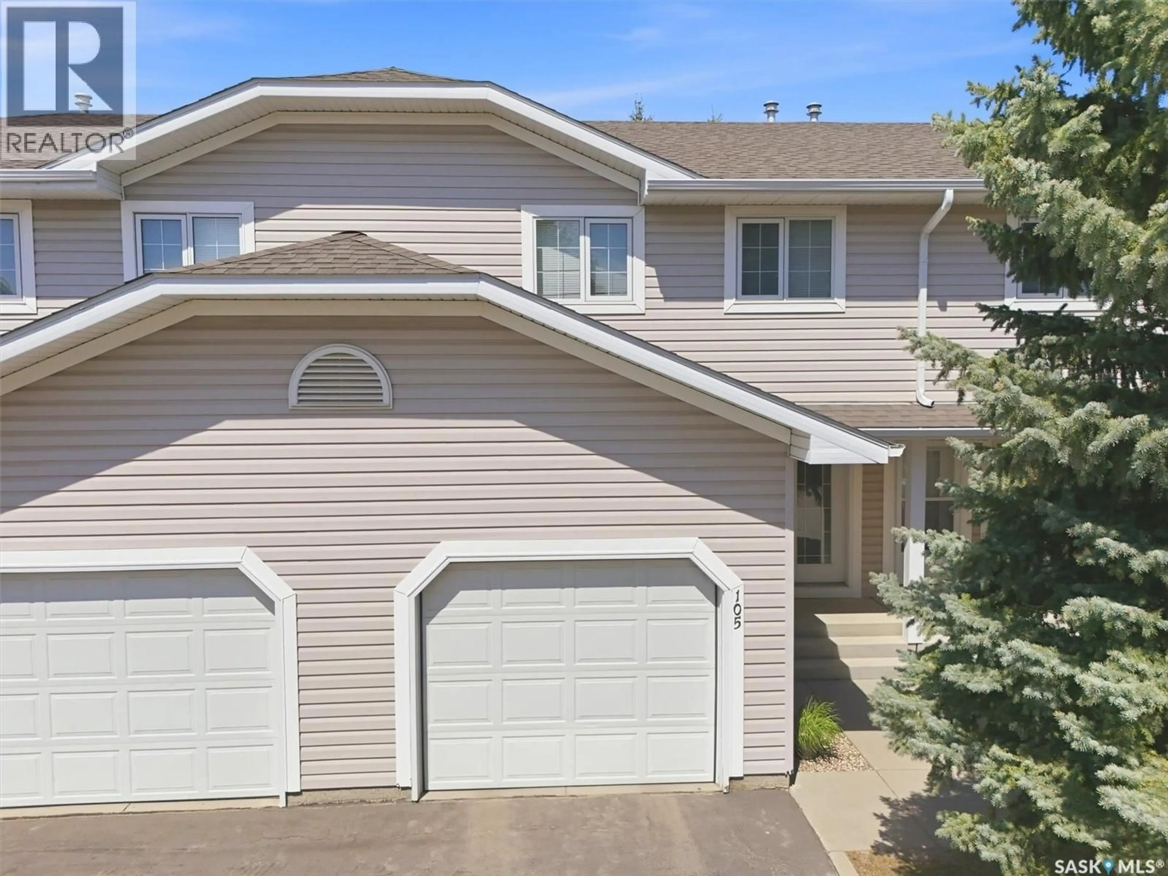 Home with vinyl exterior material, street for 105 - 615 MCWILLIE AVENUE, Saskatoon Saskatchewan S7S1J4