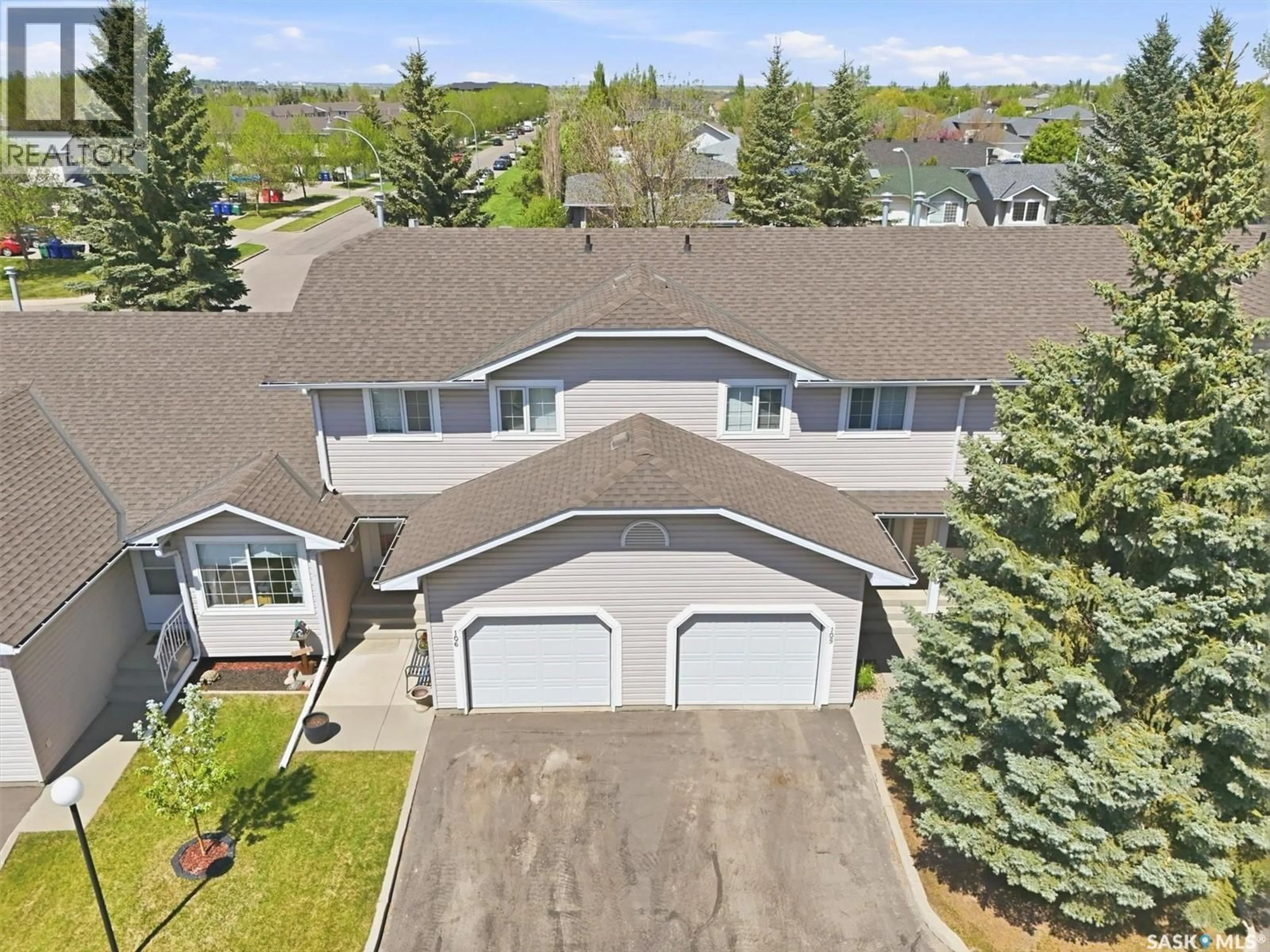 A pic from outside/outdoor area/front of a property/back of a property/a pic from drone, street for 105 - 615 MCWILLIE AVENUE, Saskatoon Saskatchewan S7S1J4