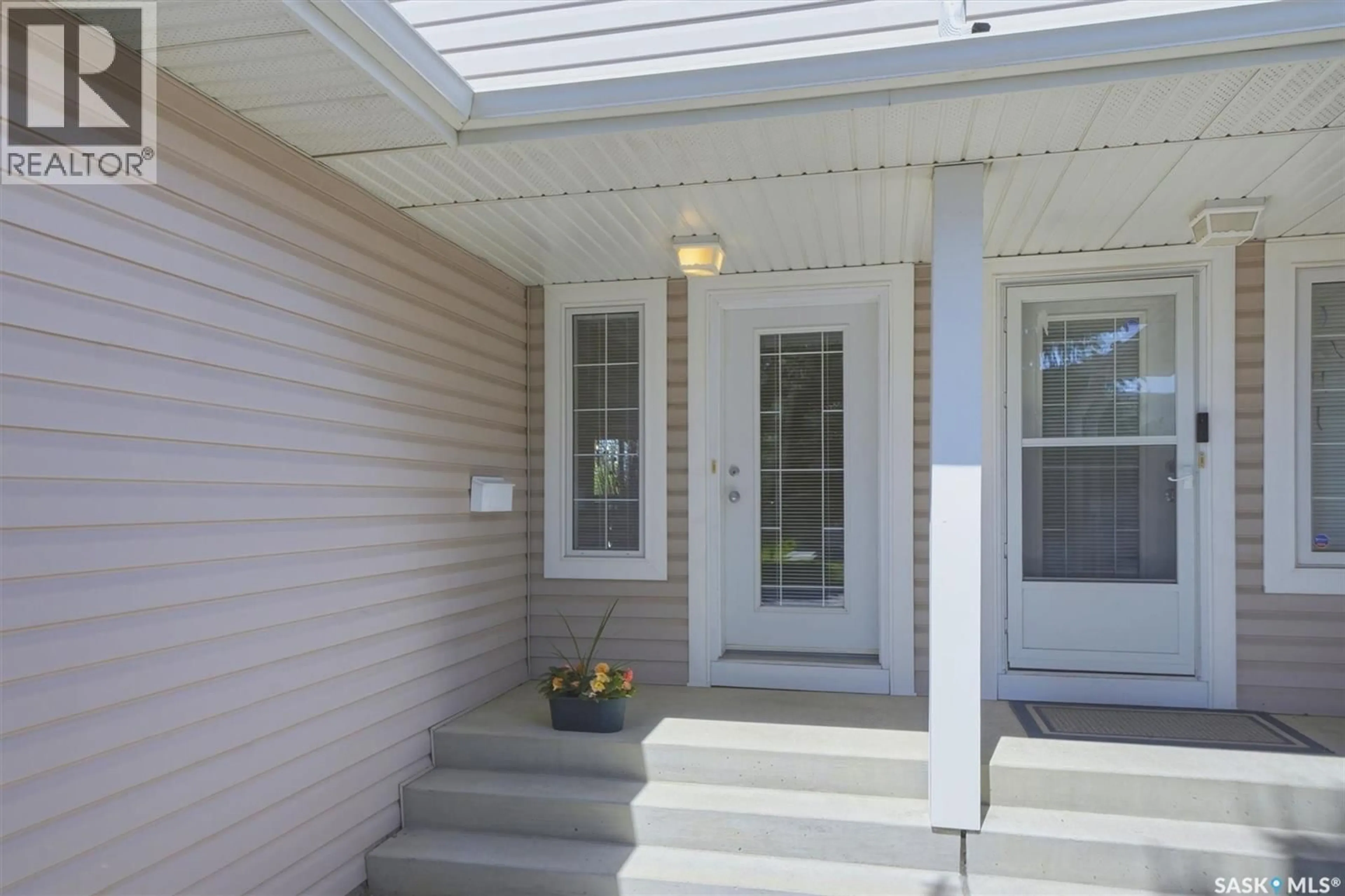 Home with vinyl exterior material, street for 105 - 615 MCWILLIE AVENUE, Saskatoon Saskatchewan S7S1J4