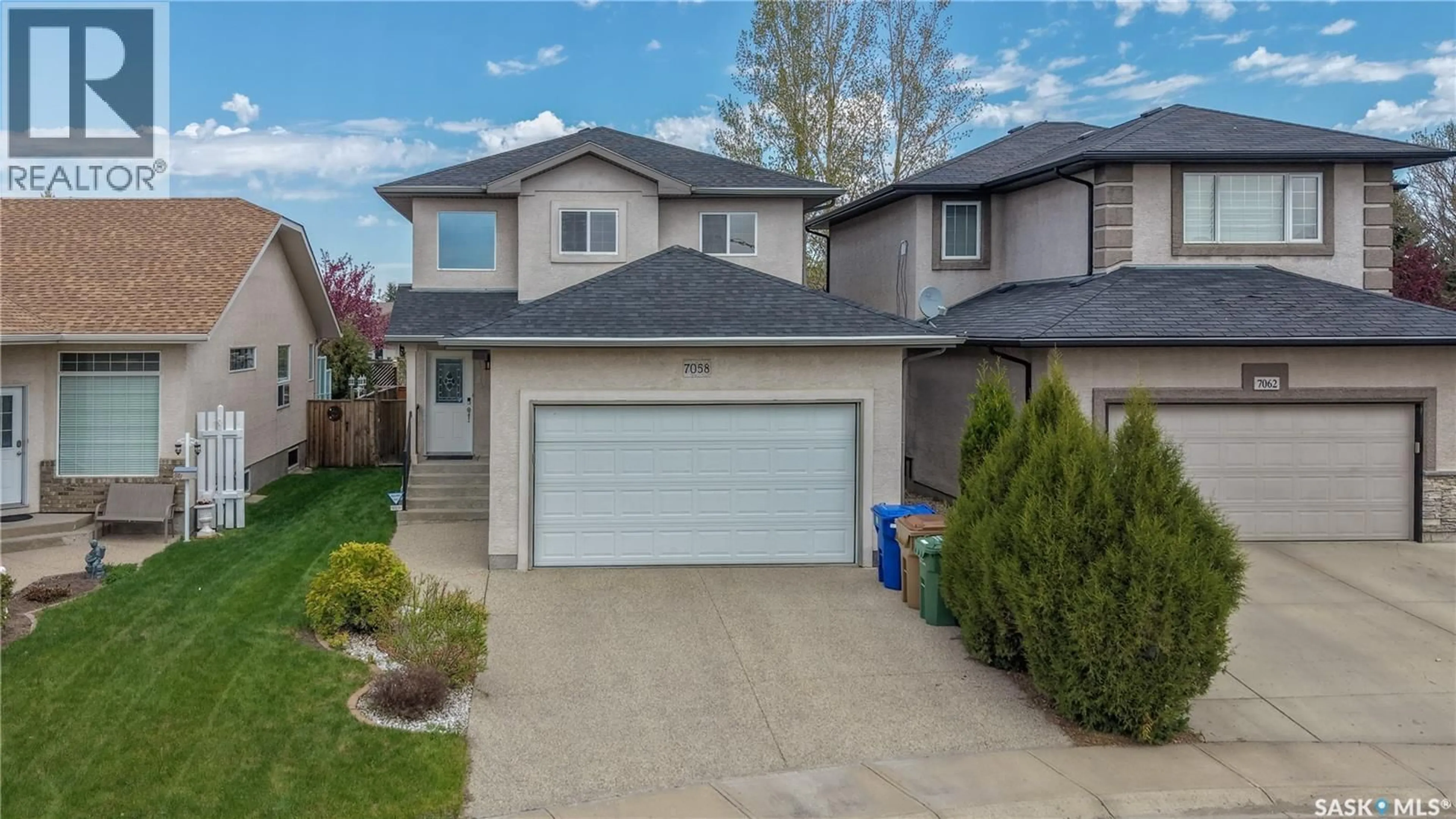 Home with vinyl exterior material, street for 7058 WASCANA COVE DRIVE, Regina Saskatchewan S4V3E9