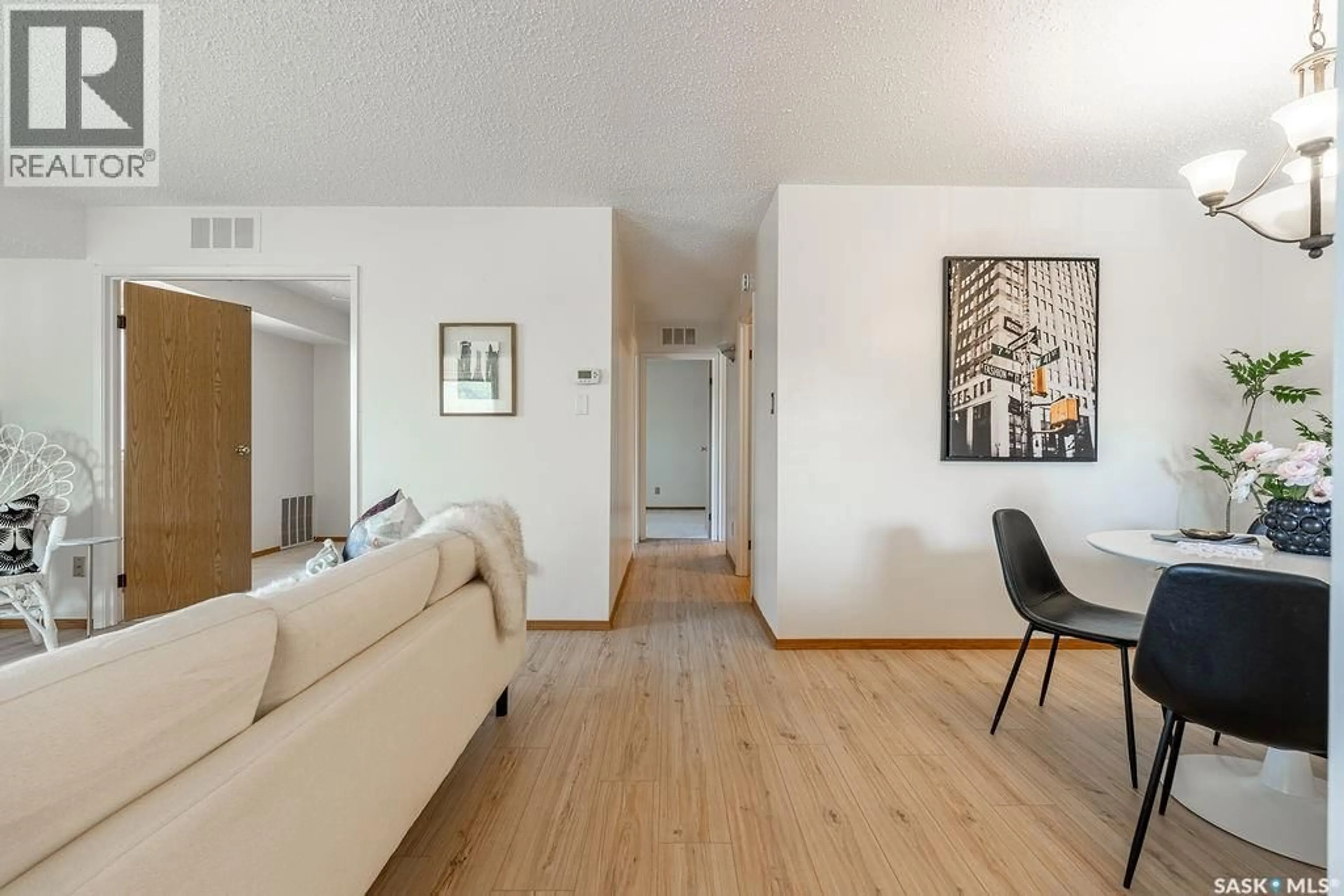 Living room with furniture, wood/laminate floor for 603 - 507 LENORE DRIVE, Saskatoon Saskatchewan S7K6S1