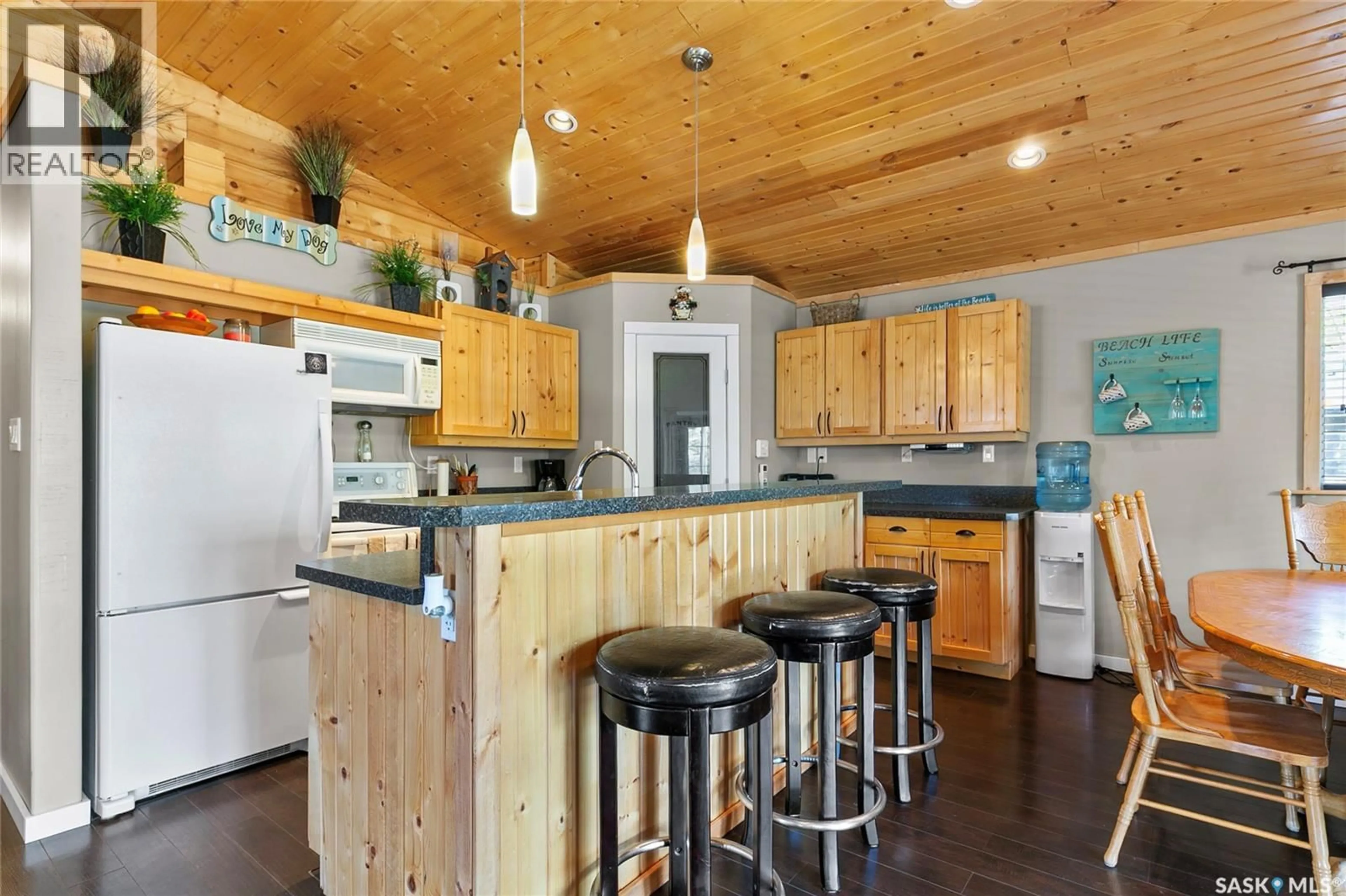 Open concept kitchen, wood/laminate floor for 22 ASH STREET, Grandview Beach Saskatchewan S0G1C0