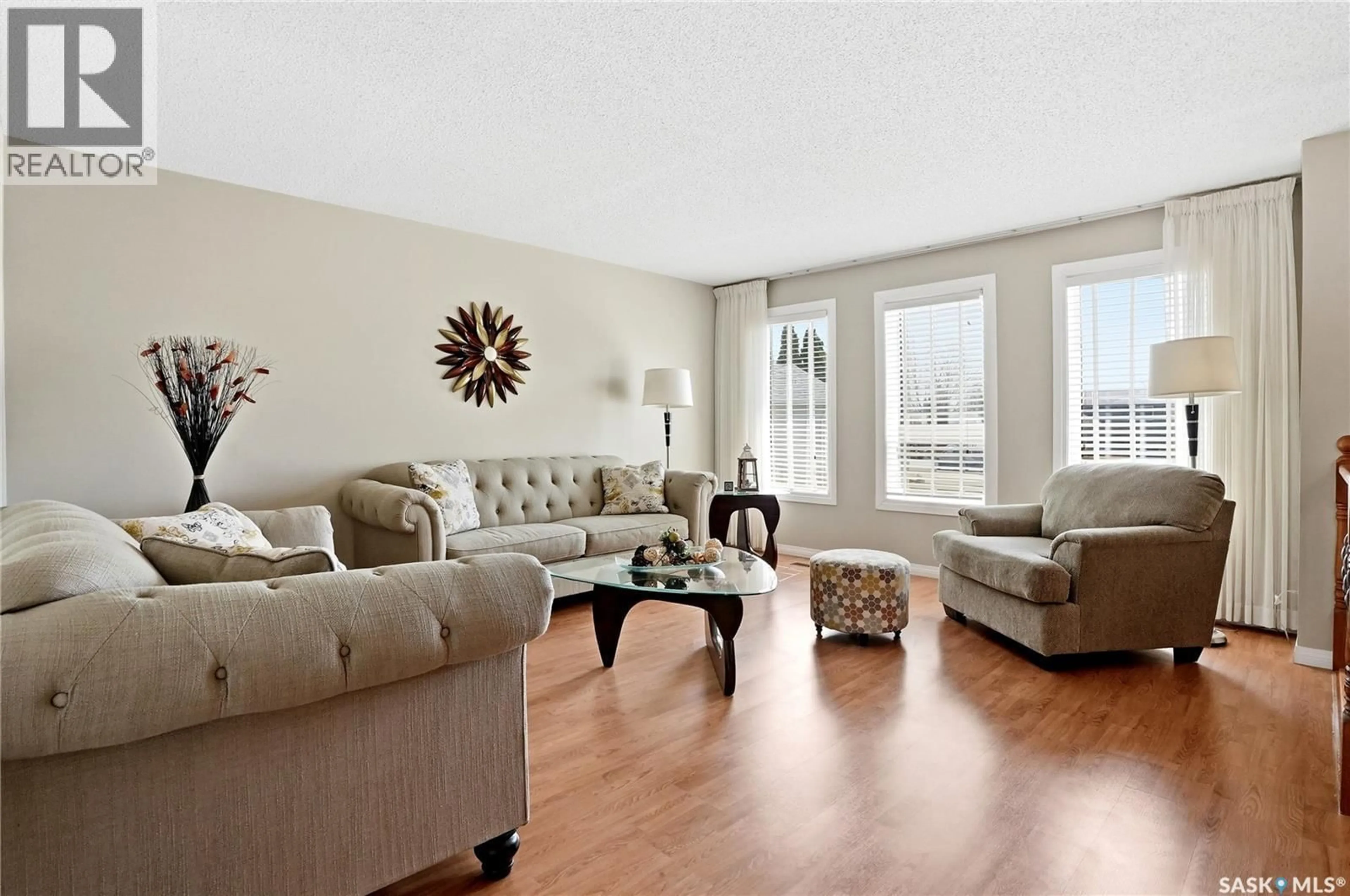 Living room with furniture, wood/laminate floor for 315 SMITH PLACE, Saskatoon Saskatchewan S7M5E7