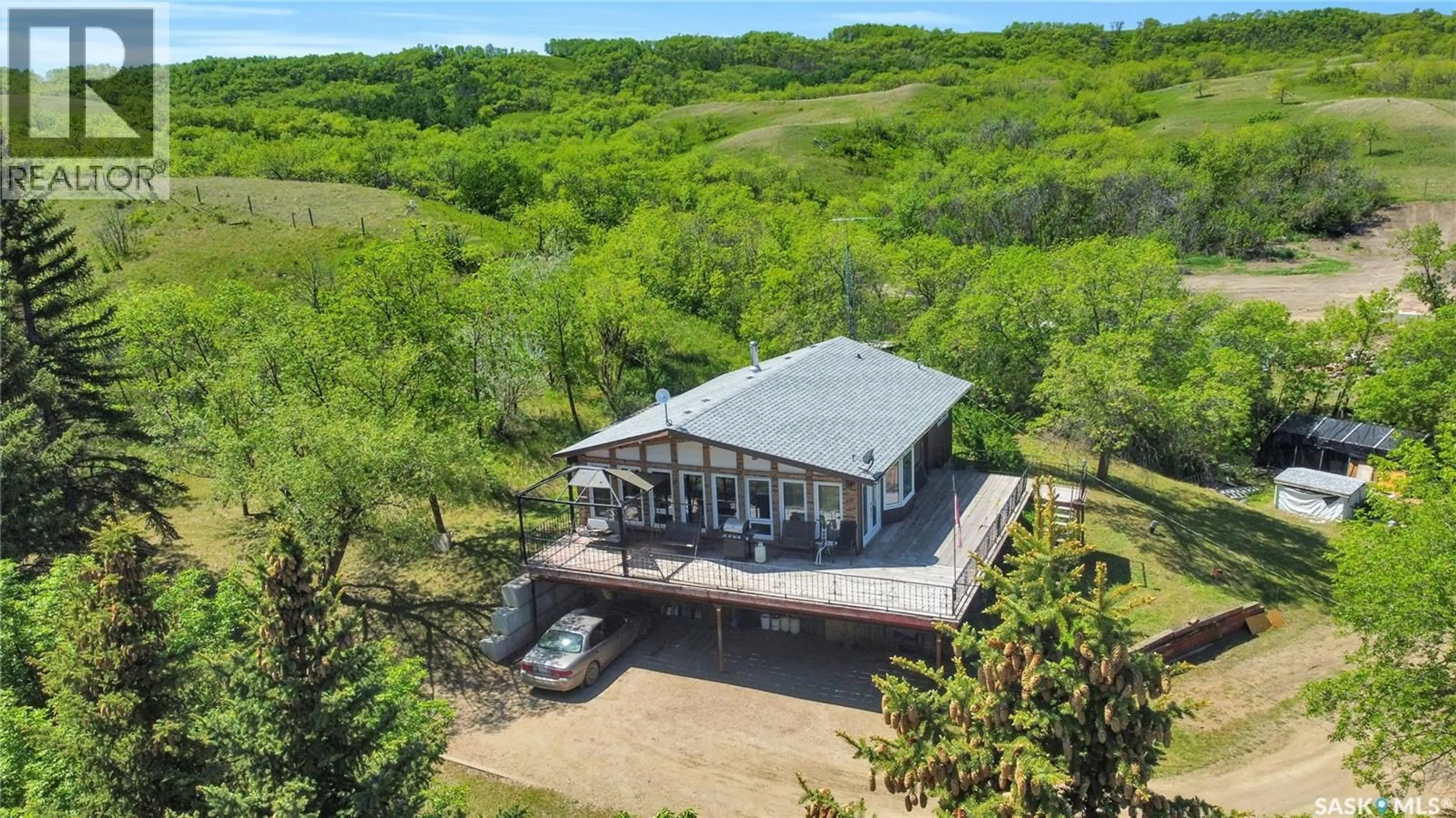 A pic from outside/outdoor area/front of a property/back of a property/a pic from drone, water/lake/river/ocean view for 701 TATANKA DRIVE, Buffalo Pound Lake Saskatchewan S6H0H0
