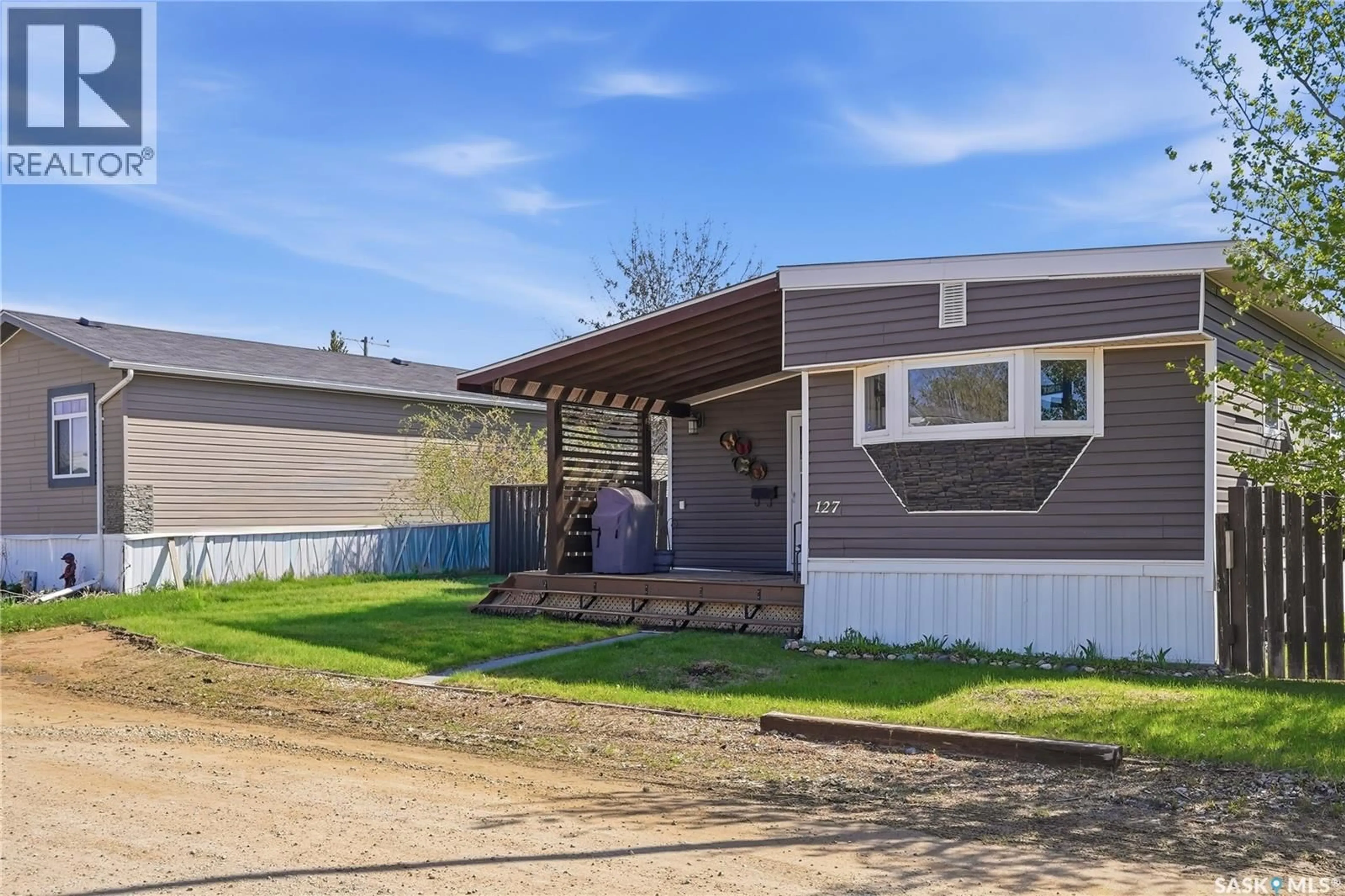 Home with vinyl exterior material, street for 127 SYCAMORE DRIVE, Blucher Rm No. 343 Saskatchewan S7B0A4