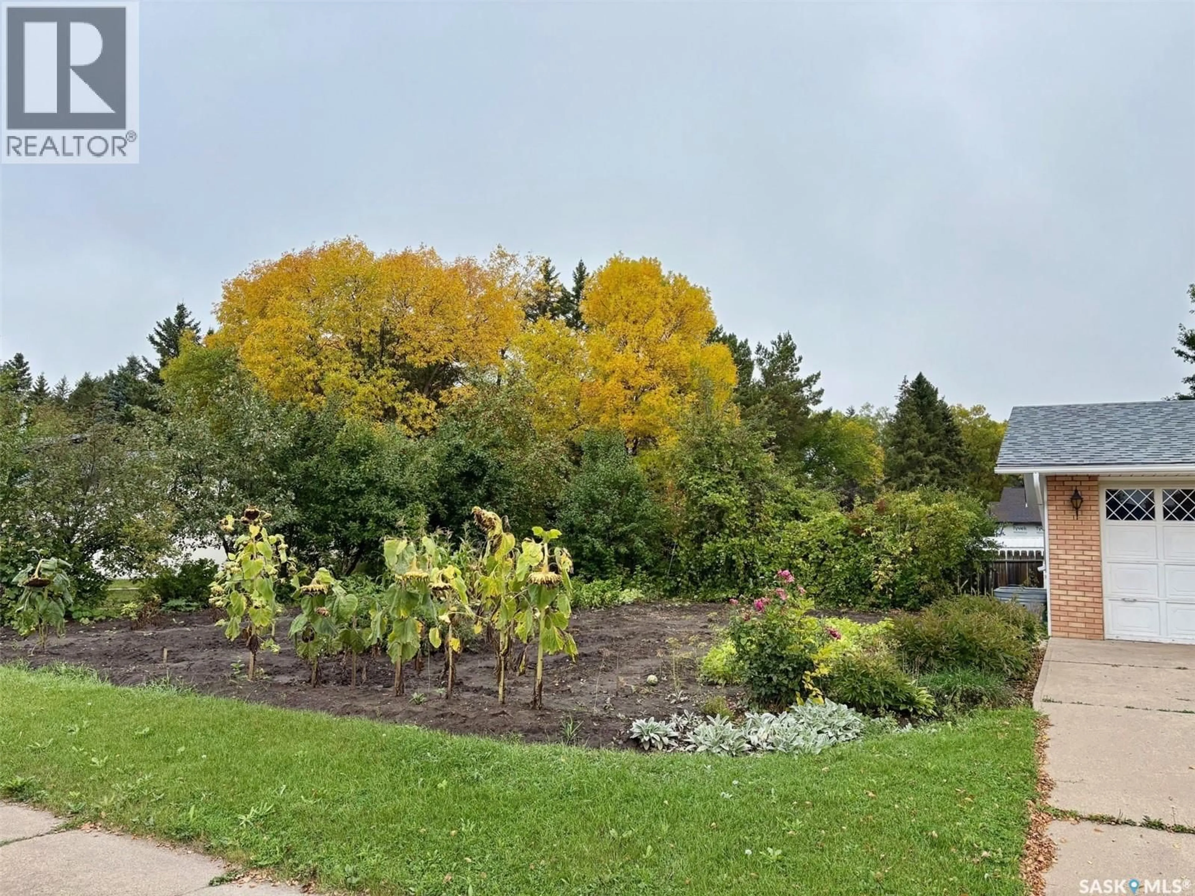 A pic from outside/outdoor area/front of a property/back of a property/a pic from drone, forest/trees view for 38 ROSEFIELD DRIVE, Yorkton Saskatchewan S3N2R4