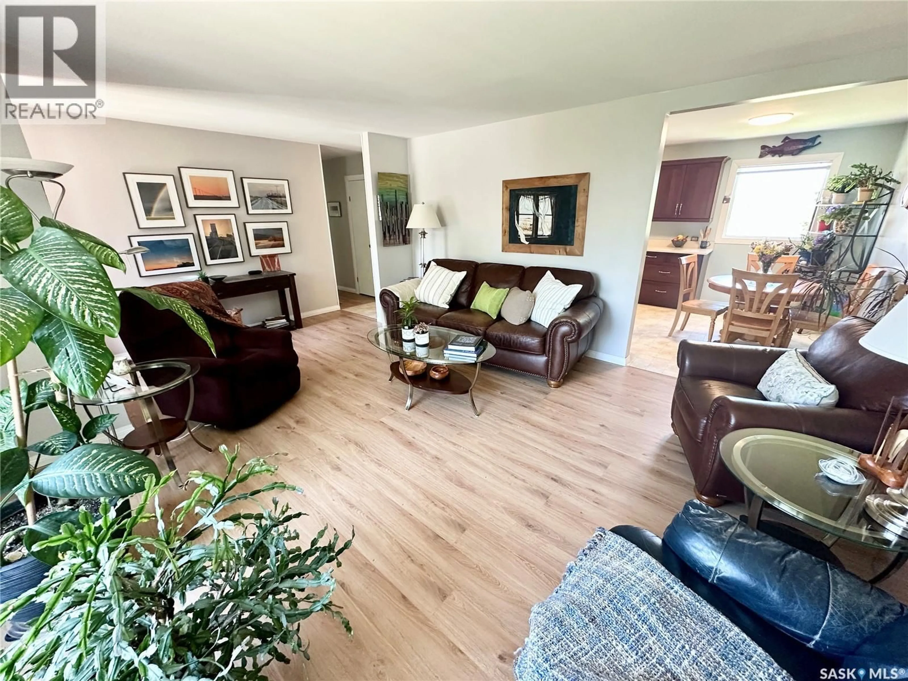 Living room with furniture, wood/laminate floor for 309 RUSSELL STREET, Stoughton Saskatchewan S0G4T0