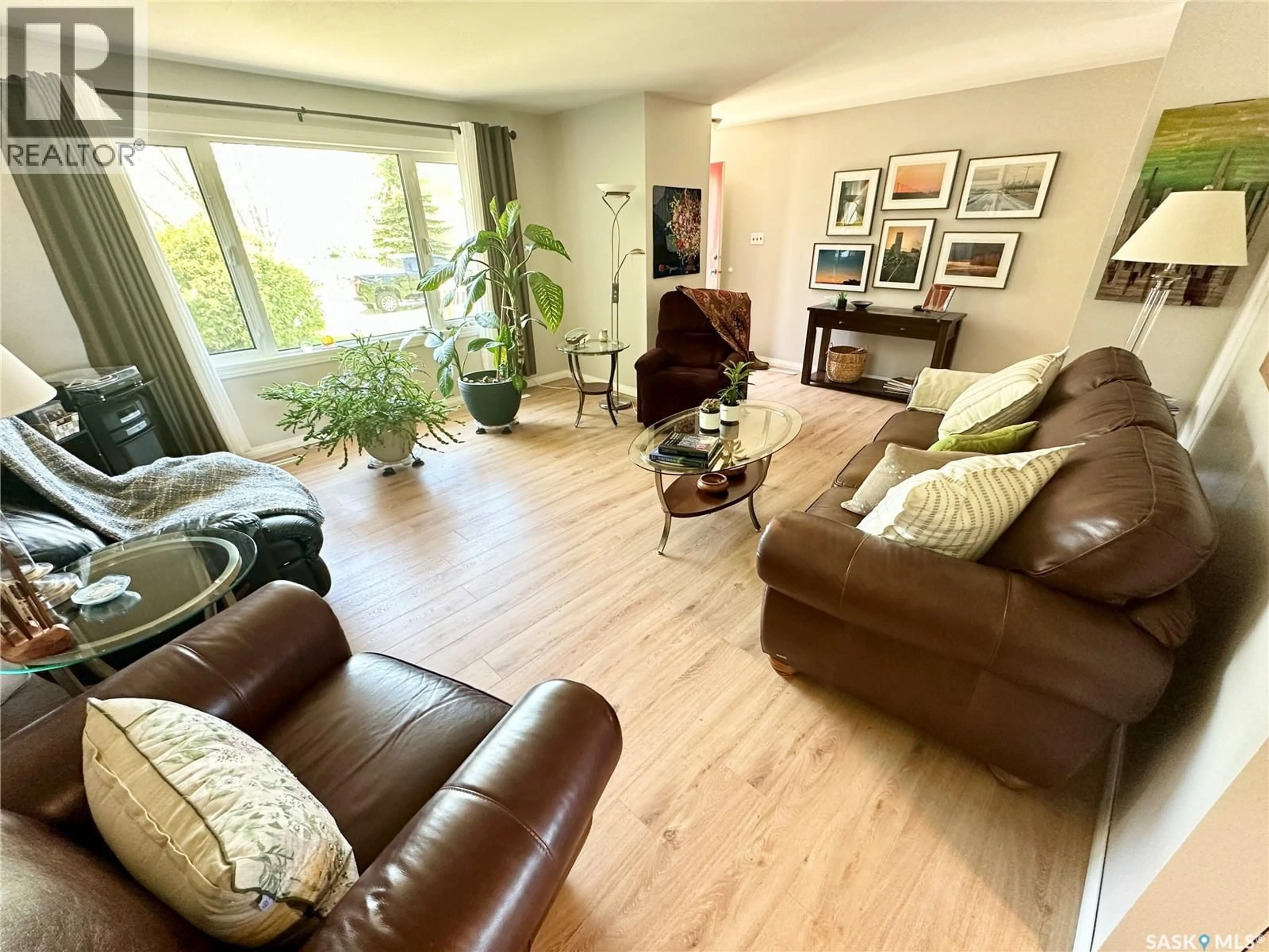 Living room with furniture, wood/laminate floor for 309 RUSSELL STREET, Stoughton Saskatchewan S0G4T0