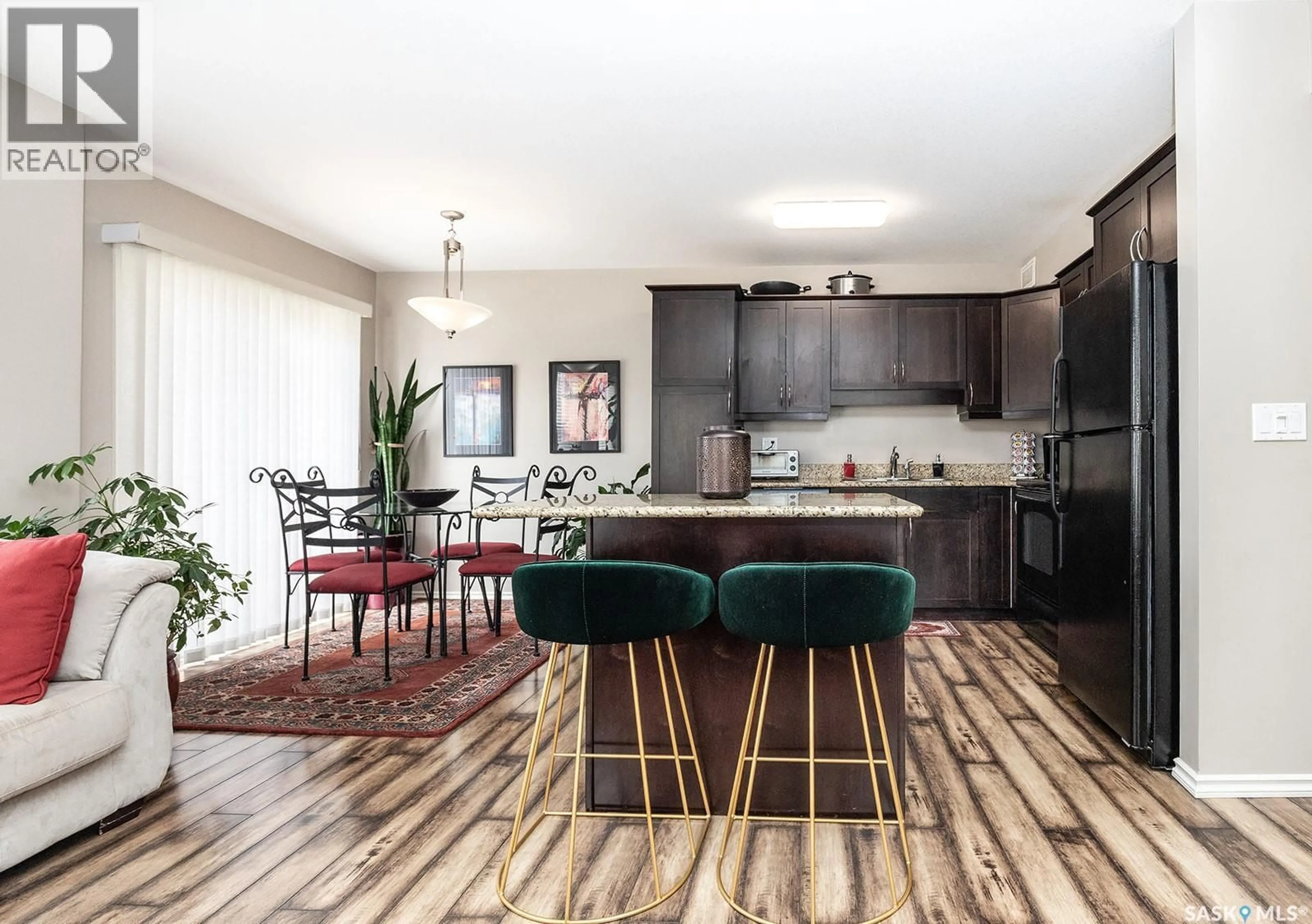 Open concept kitchen, wood/laminate floor for 615 - 214 LYND CRESCENT, Saskatoon Saskatchewan S7T0G8
