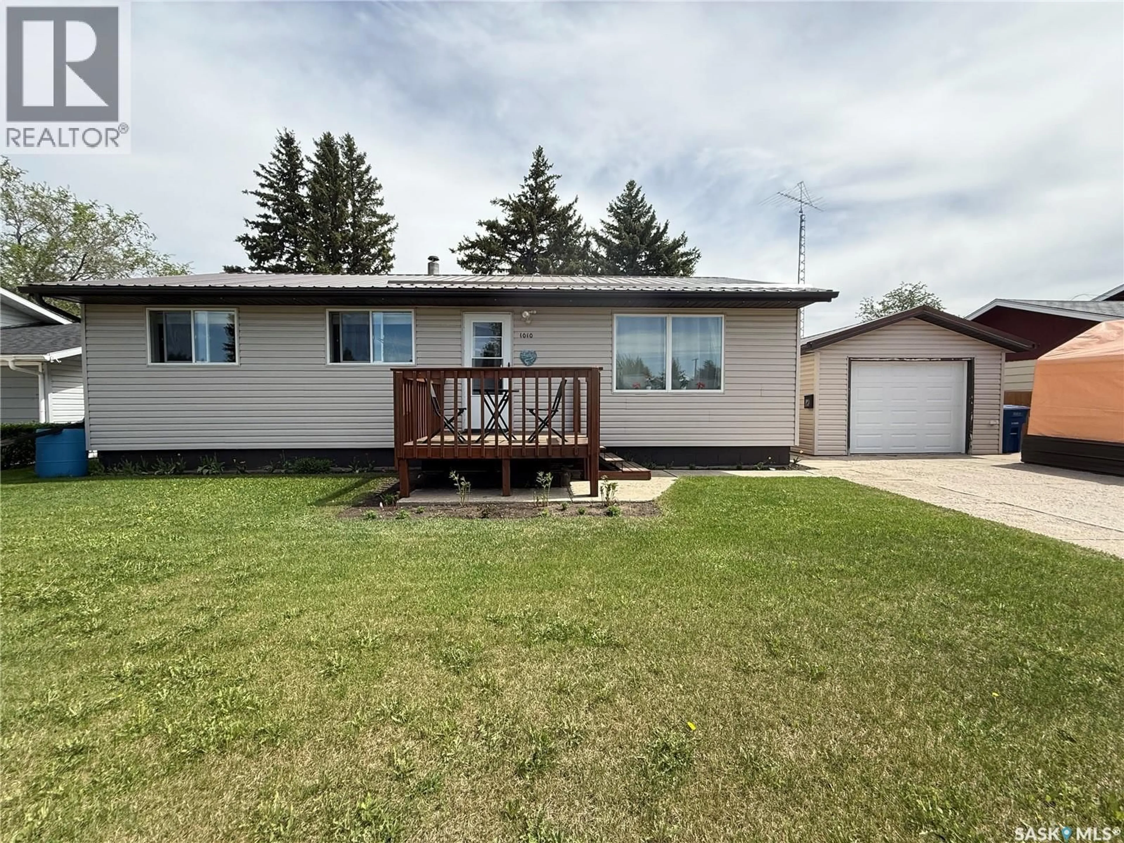 Home with vinyl exterior material, street for 1010 11TH STREET, Humboldt Saskatchewan S0K2A0