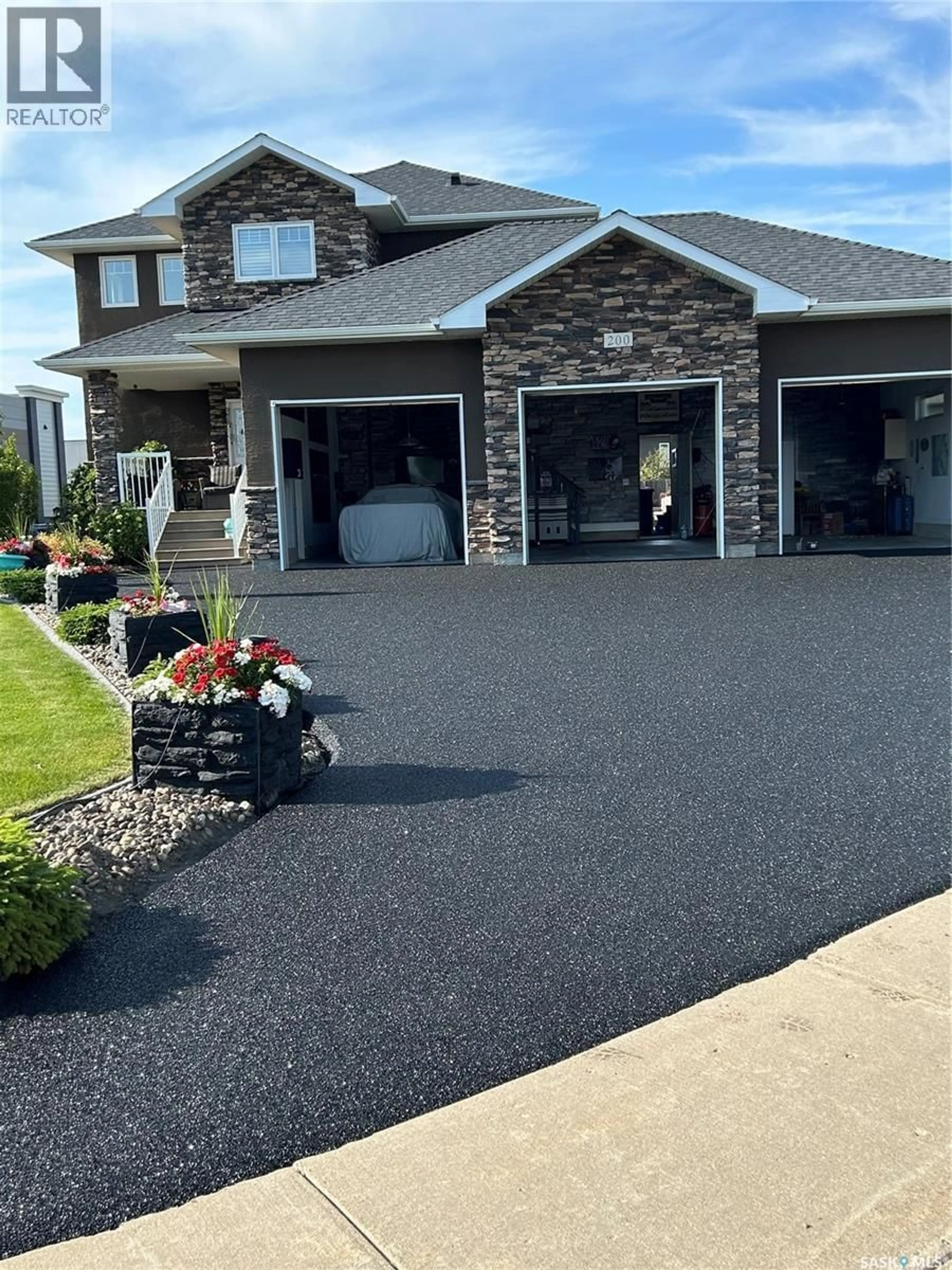 Home with vinyl exterior material, street for 200 CLUBHOUSE BOULEVARD, Warman Saskatchewan S0K4S1