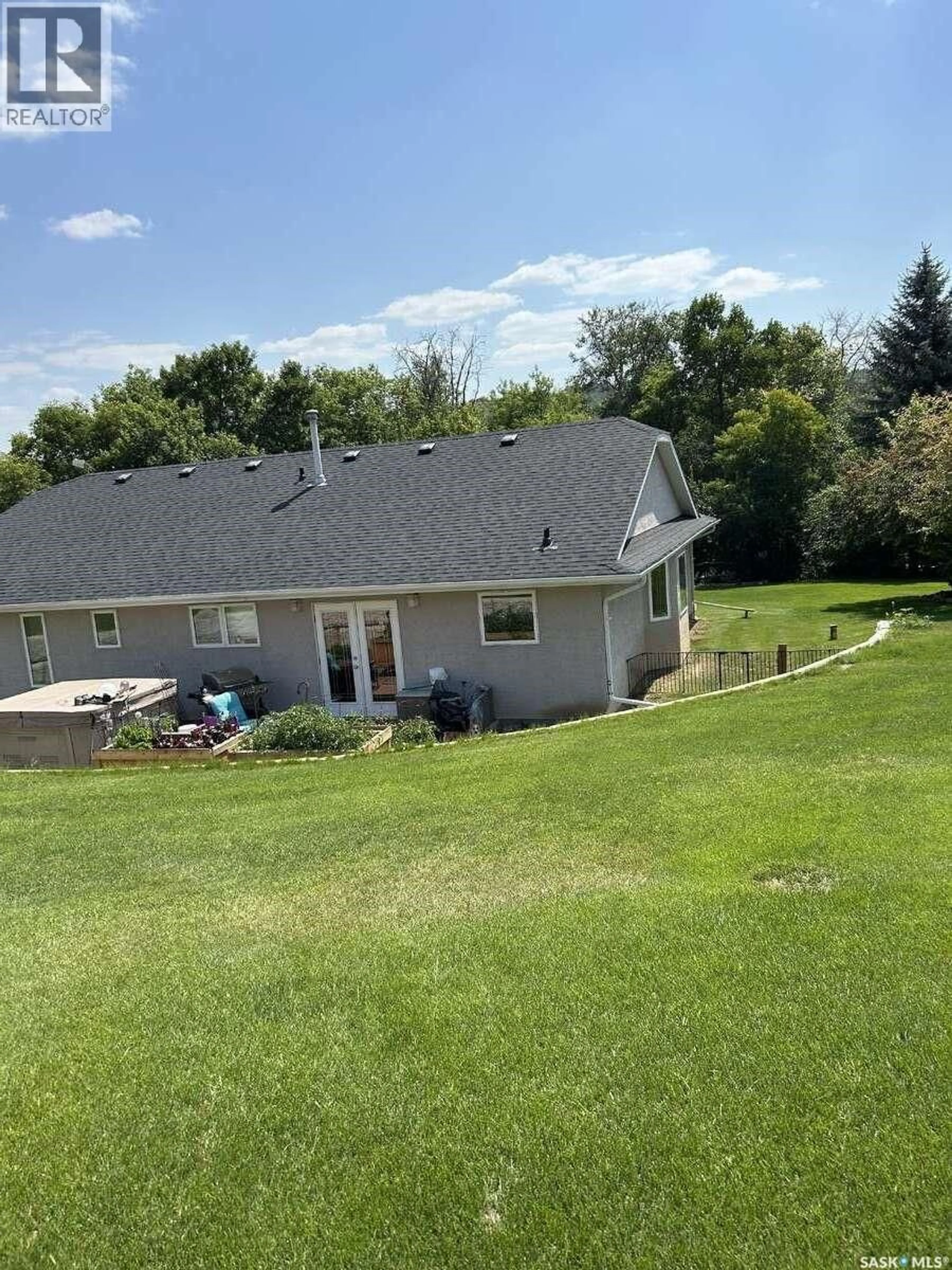 A pic from outside/outdoor area/front of a property/back of a property/a pic from drone, unknown for 15 KELLY DRIVE, Fort Qu'Appelle Saskatchewan S0G1S0