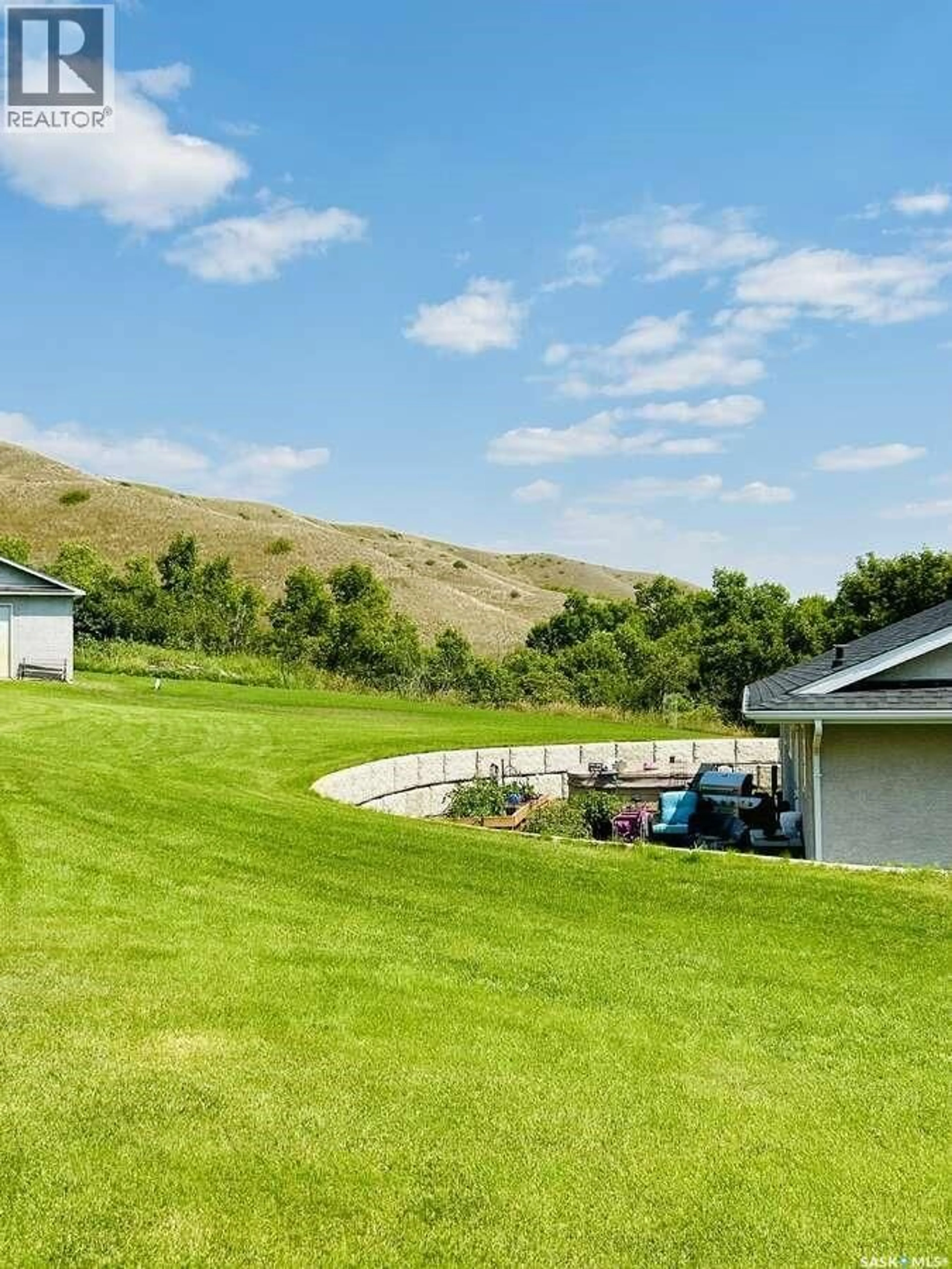 A pic from outside/outdoor area/front of a property/back of a property/a pic from drone, mountain view for 15 KELLY DRIVE, Fort Qu'Appelle Saskatchewan S0G1S0