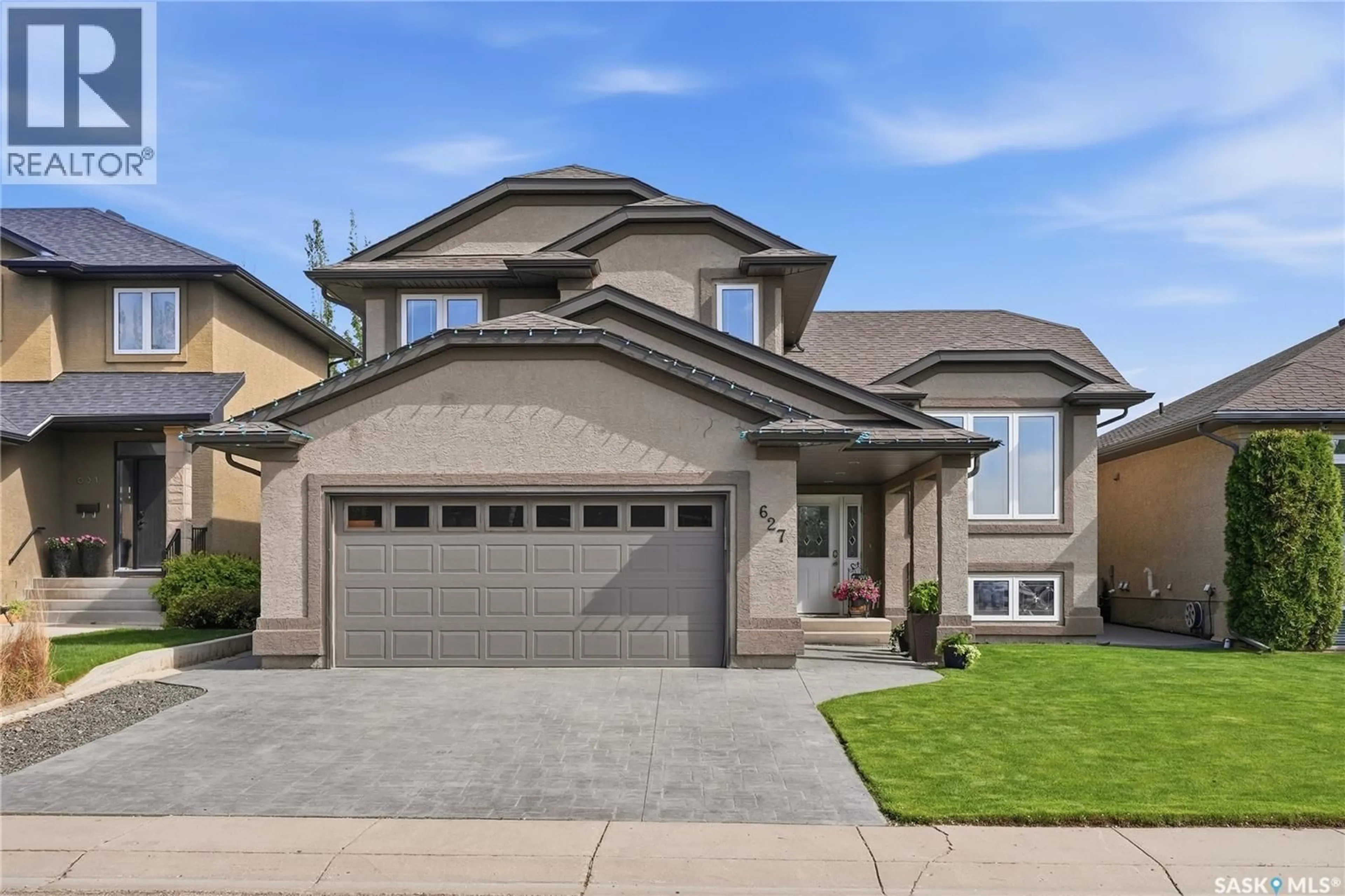 Home with brick exterior material, street for 627 PATON WAY, Saskatoon Saskatchewan S7W0C1