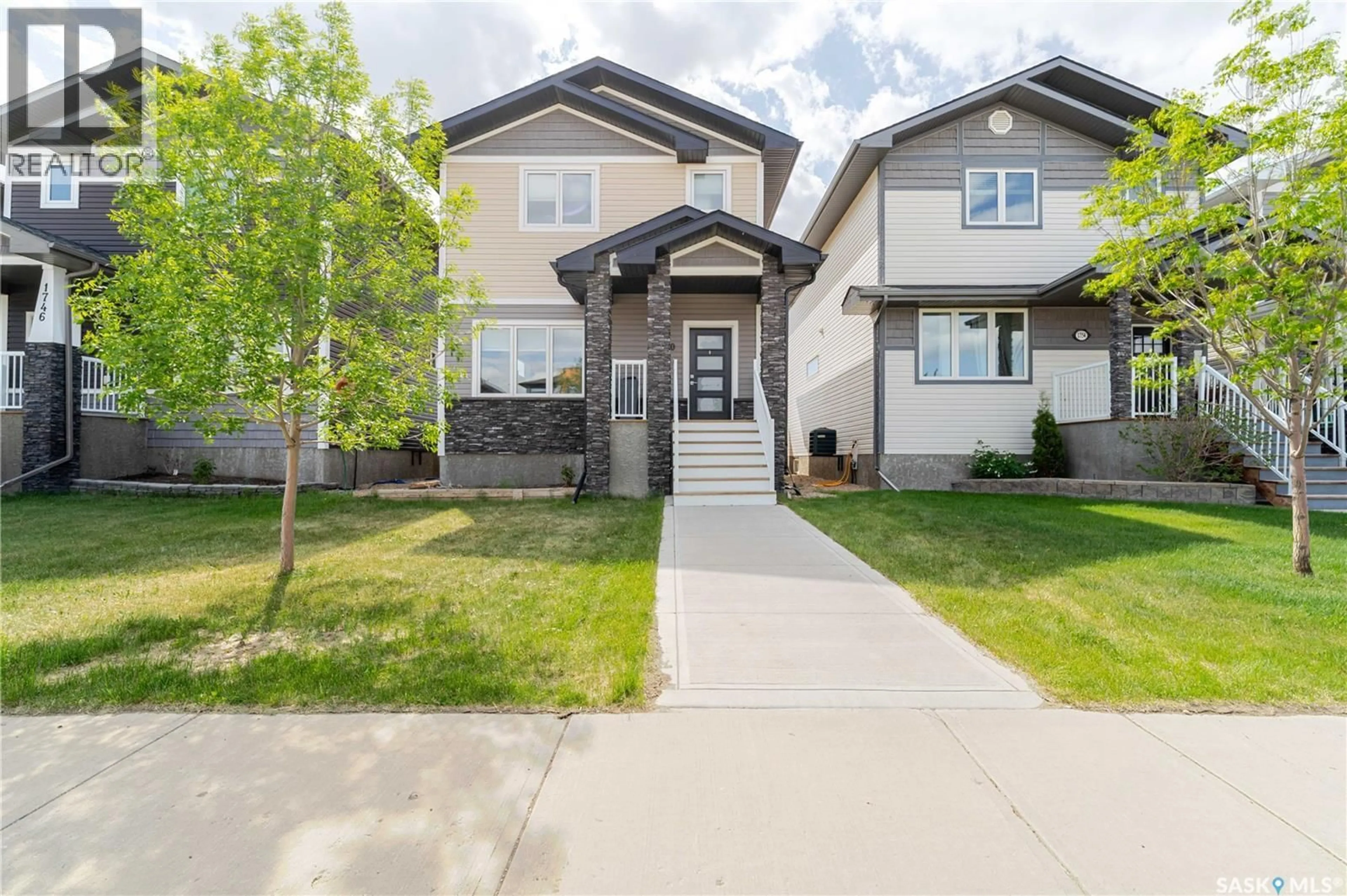 Home with vinyl exterior material, street for 1750 11TH AVENUE, Moose Jaw Saskatchewan S6J0B3