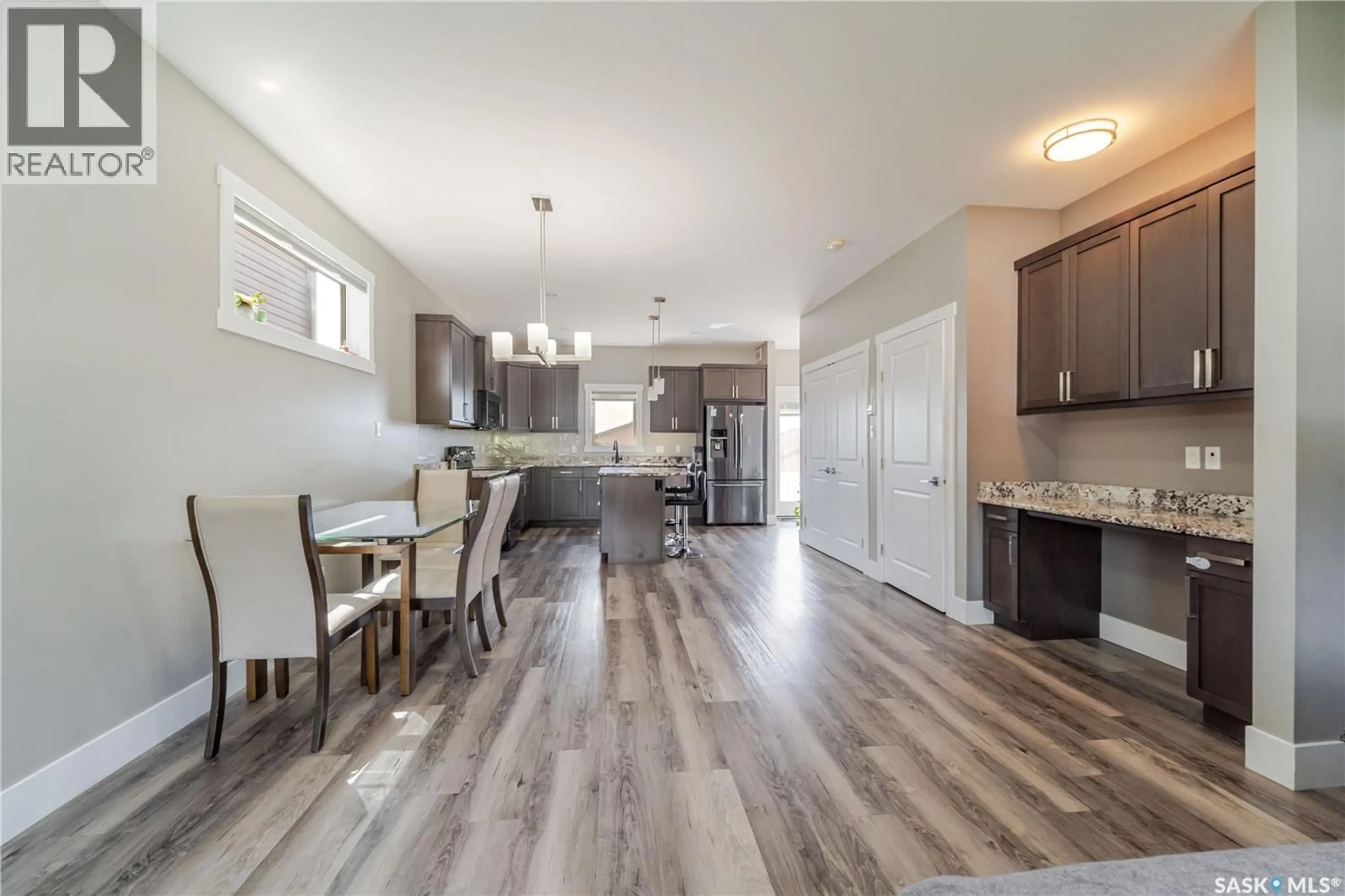 Open concept kitchen, wood/laminate floor for 1750 11TH AVENUE, Moose Jaw Saskatchewan S6J0B3