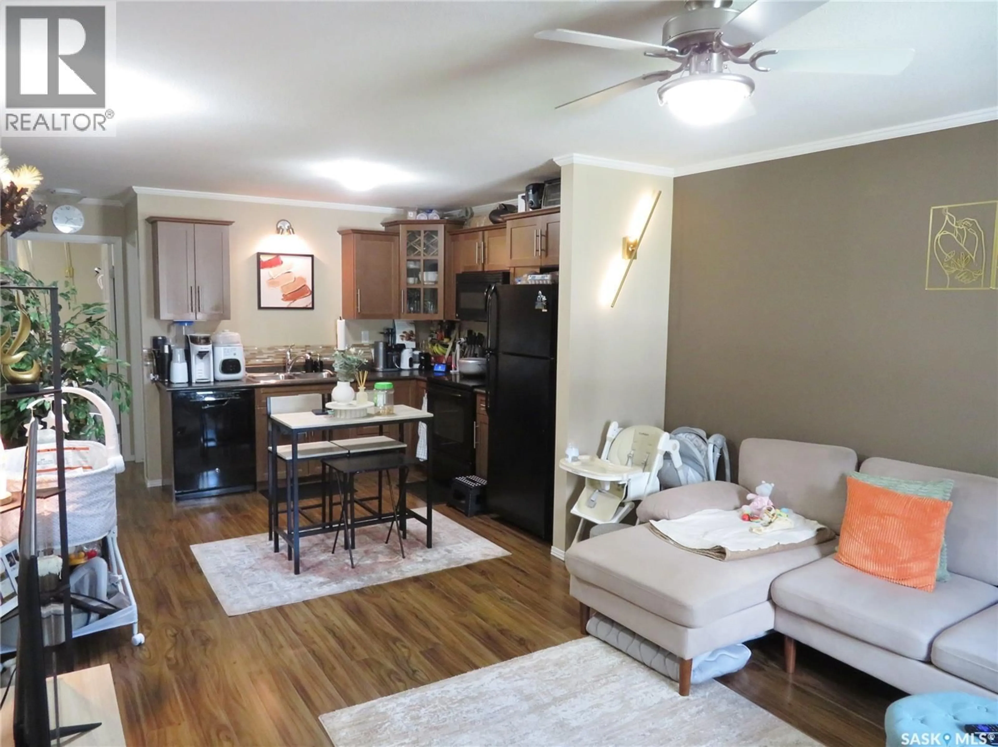 Open concept kitchen, wood/laminate floor for 115 - 101 DALGLEISH LINK, Saskatoon Saskatchewan S7W0N5