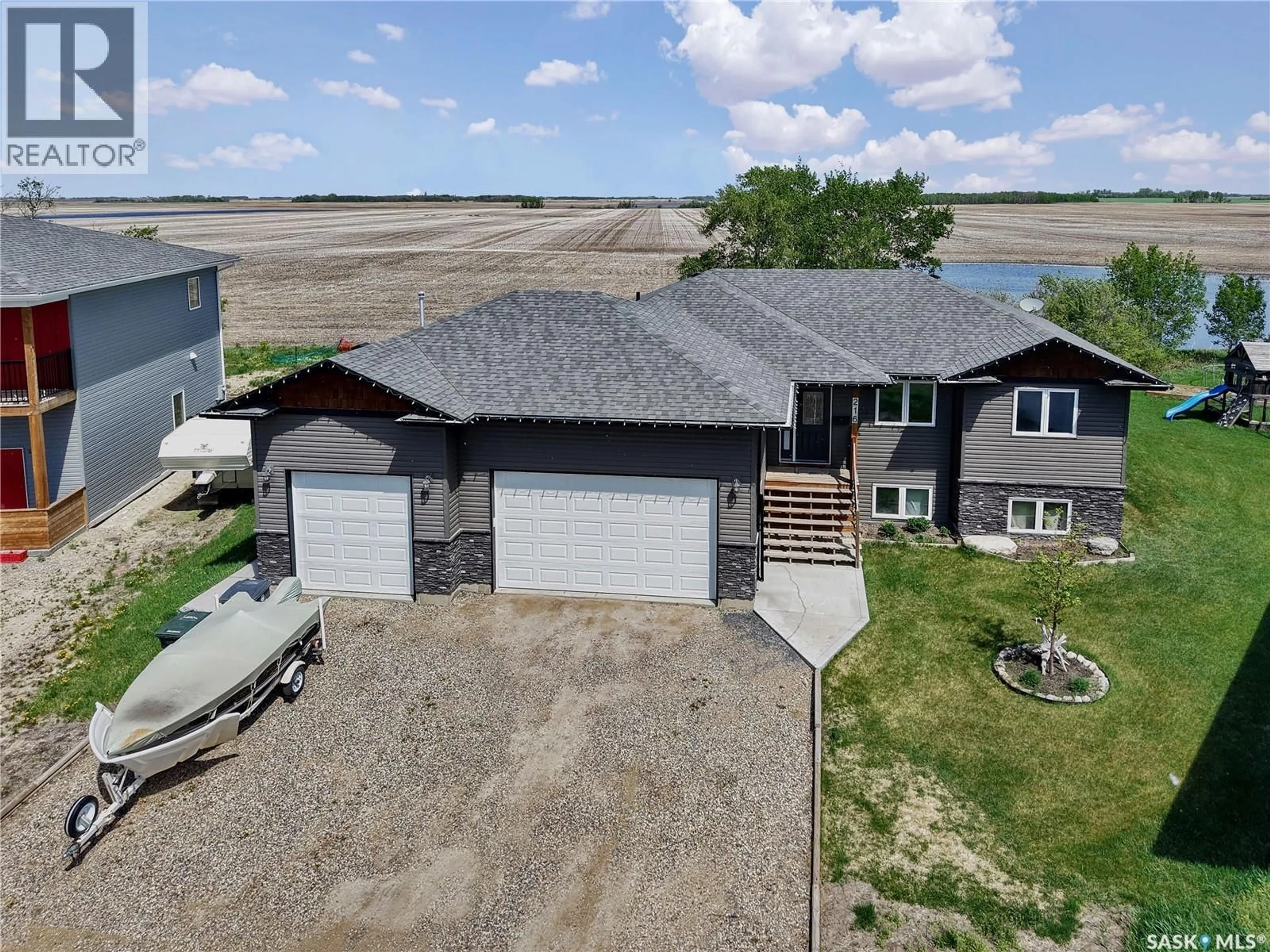 A pic from outside/outdoor area/front of a property/back of a property/a pic from drone, water/lake/river/ocean view for 216 NORTH HILL ROAD, Hepburn Saskatchewan S0K1Z0