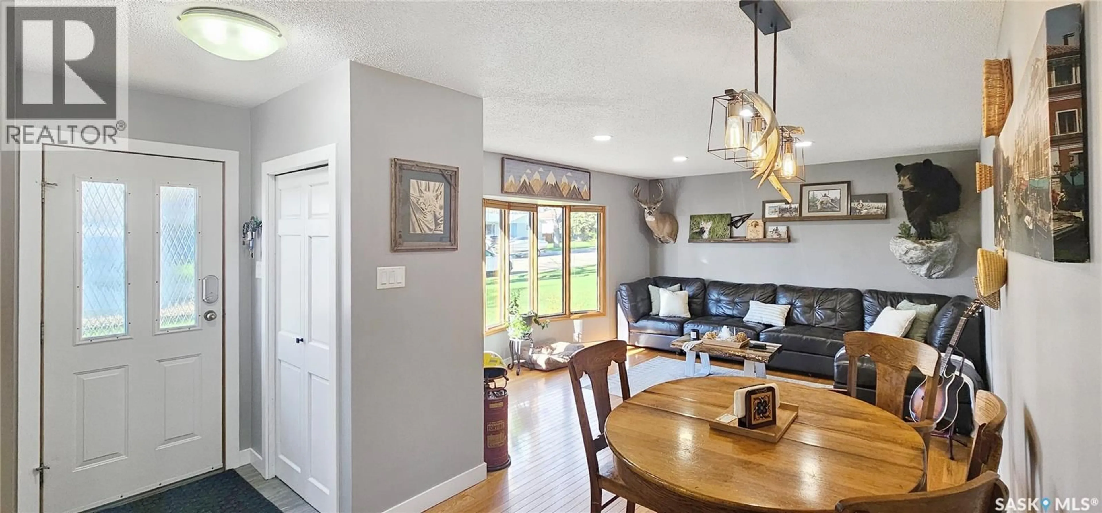Open concept kitchen, wood/laminate floor for 1406 ASHLEY DRIVE, Swift Current Saskatchewan S9H1N5