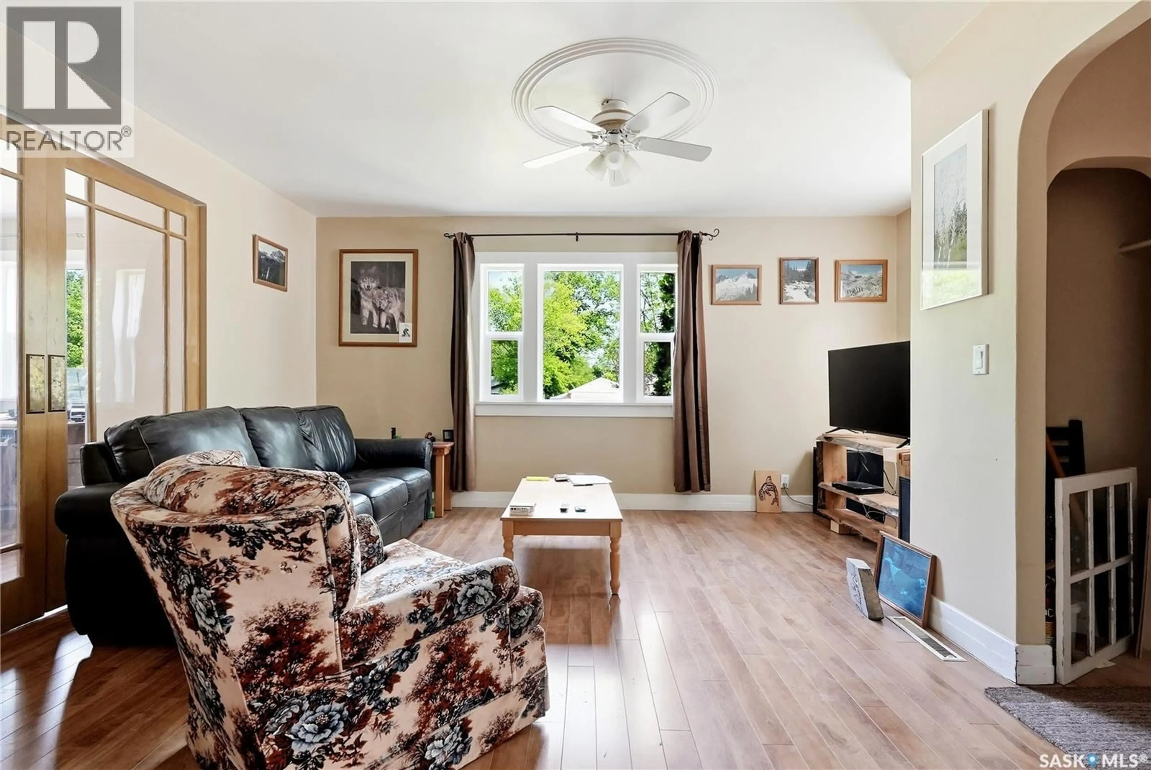Living room with furniture, wood/laminate floor for 340 CHARLES STREET, Asquith Saskatchewan S0K0J0