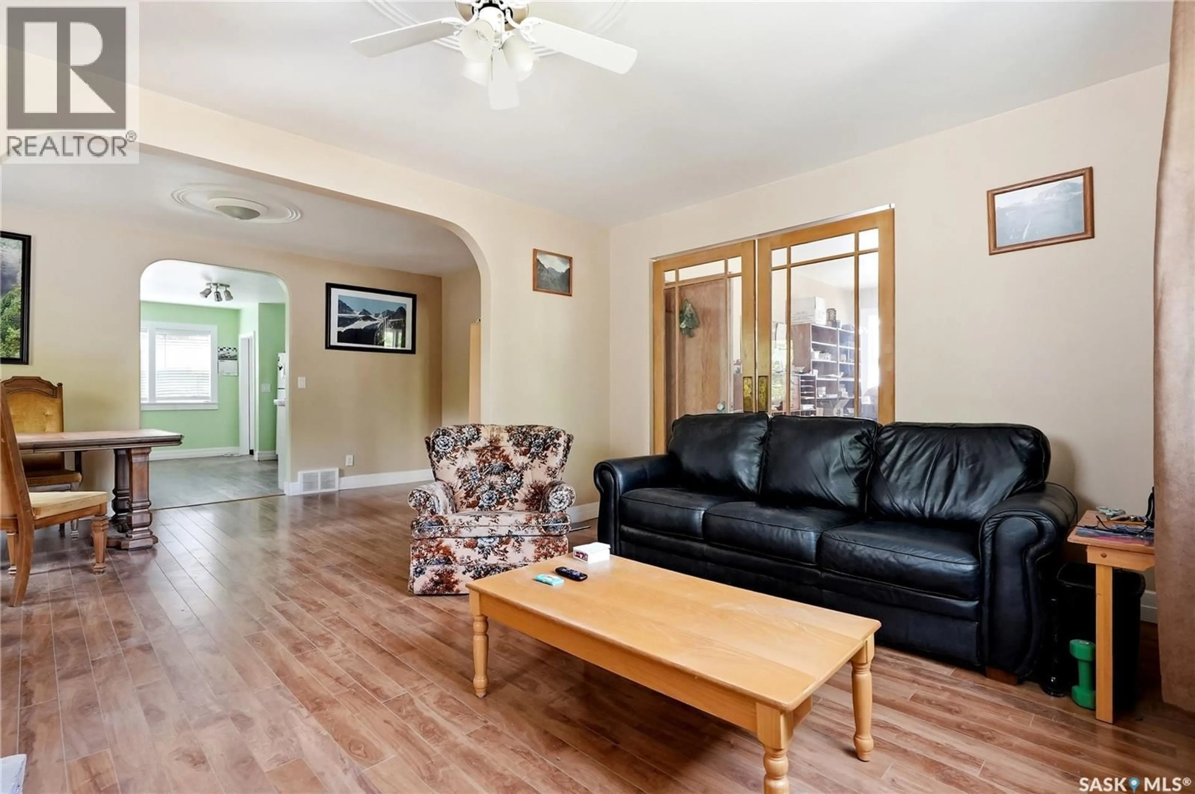 Living room with furniture, wood/laminate floor for 340 CHARLES STREET, Asquith Saskatchewan S0K0J0