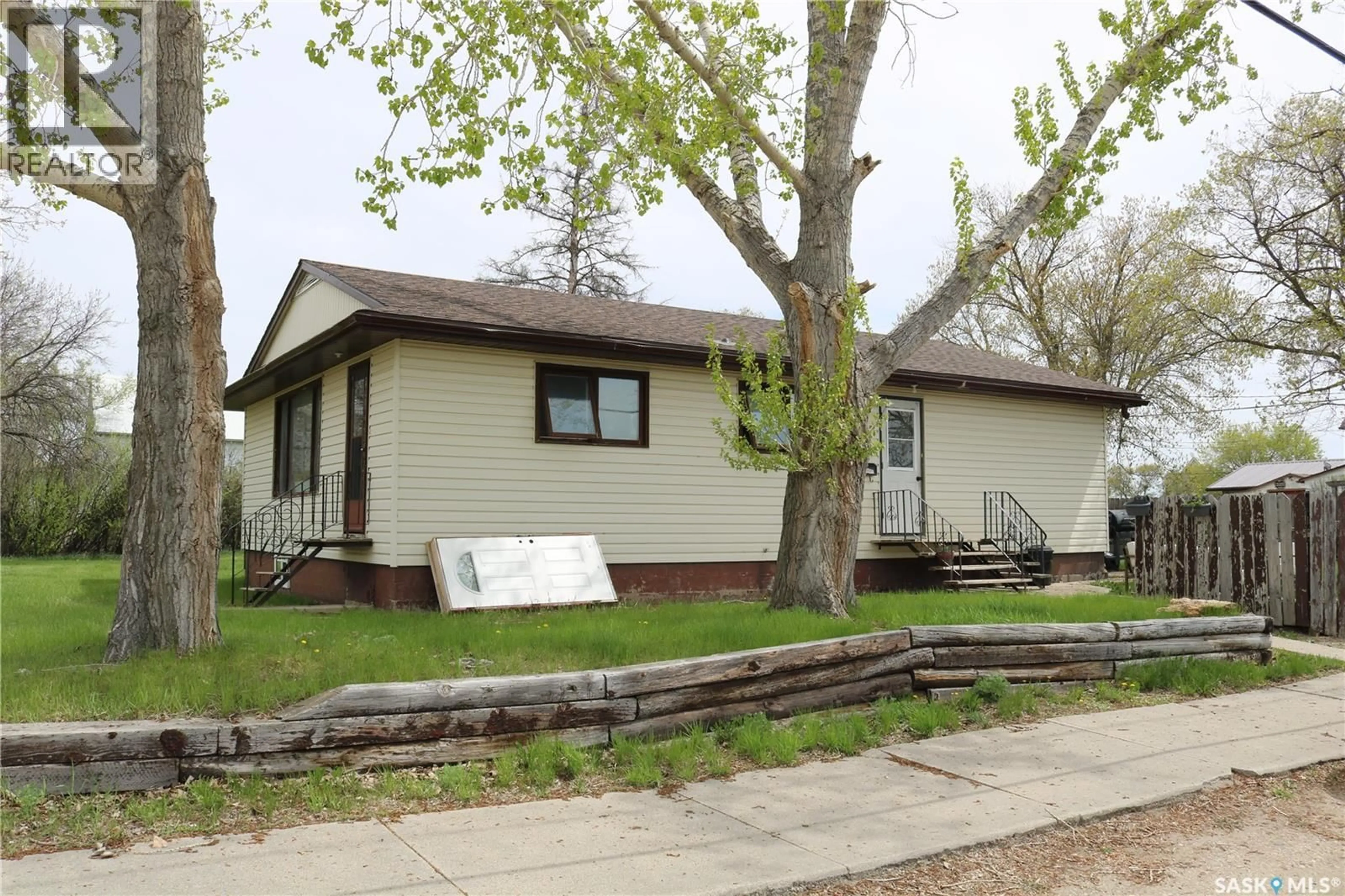 Home with vinyl exterior material, street for 202 MAIN STREET, Young Saskatchewan S0K4Y0