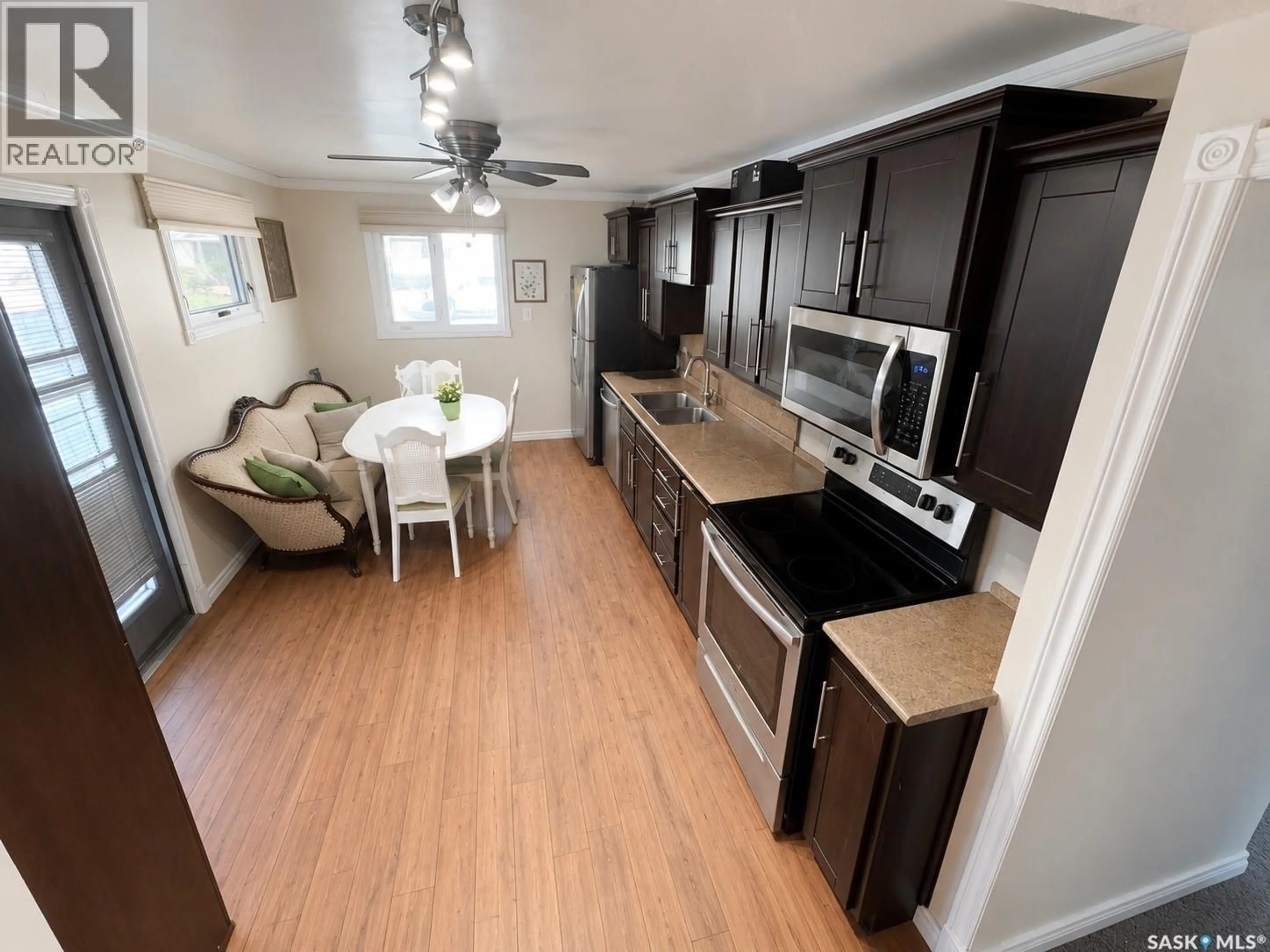Open concept kitchen, wood/laminate floor for 1410 4TH AVENUE, Regina Saskatchewan S4R0T1