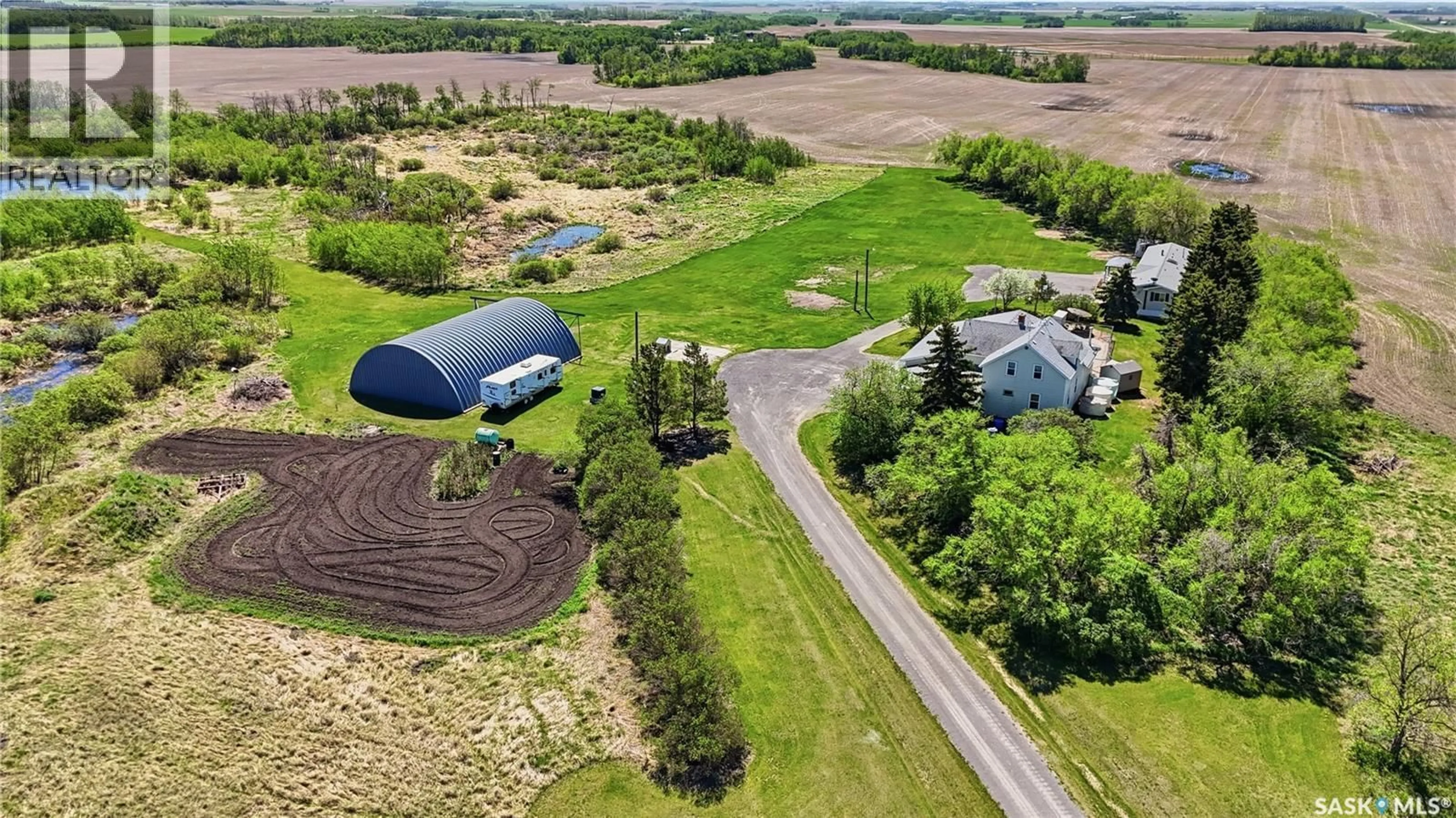 A pic from outside/outdoor area/front of a property/back of a property/a pic from drone, unknown for DONAIS ACREAGE, Edenwold Rm No.158 Saskatchewan S0G5K0