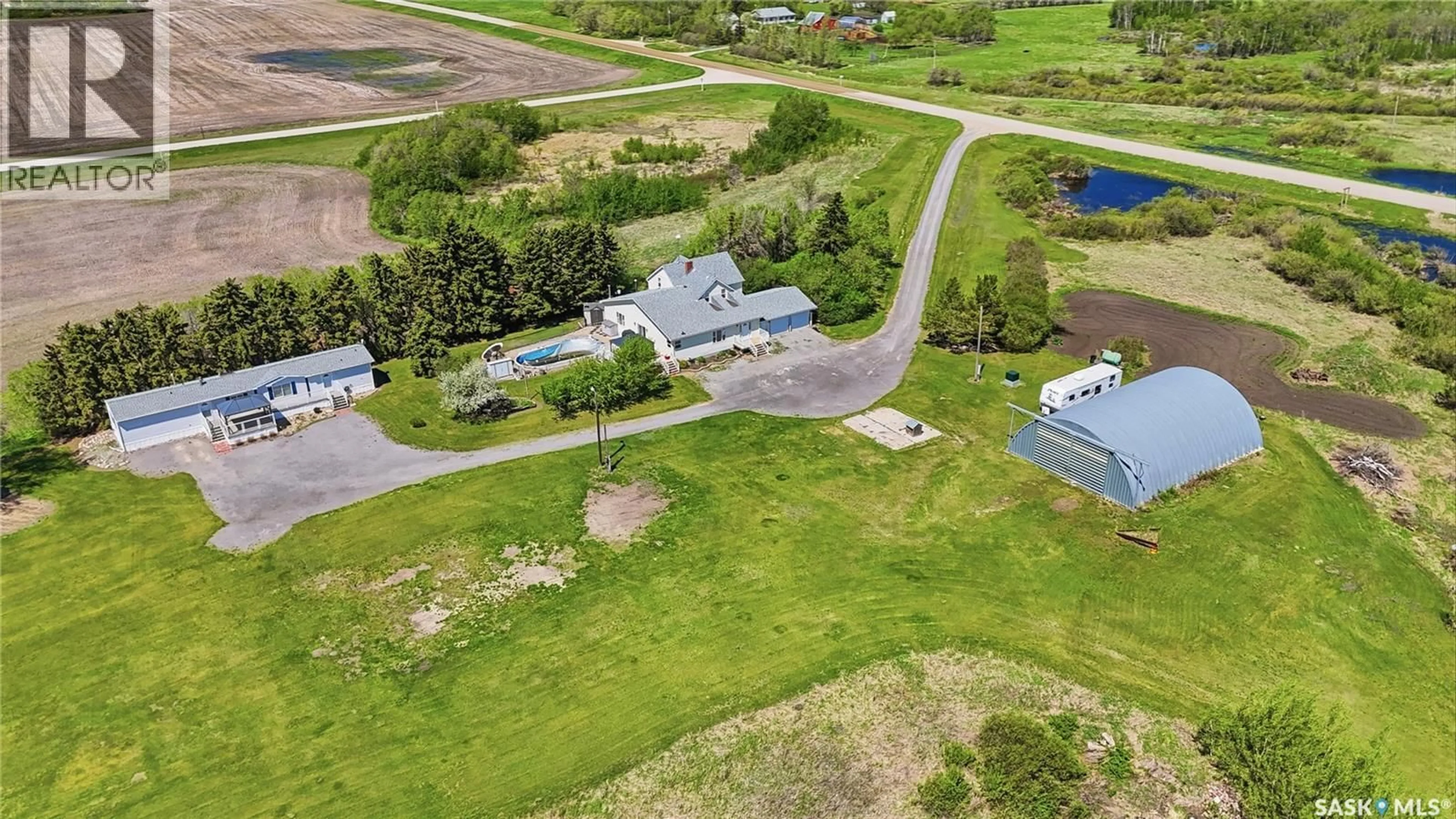 A pic from outside/outdoor area/front of a property/back of a property/a pic from drone, unknown for DONAIS ACREAGE, Edenwold Rm No.158 Saskatchewan S0G5K0