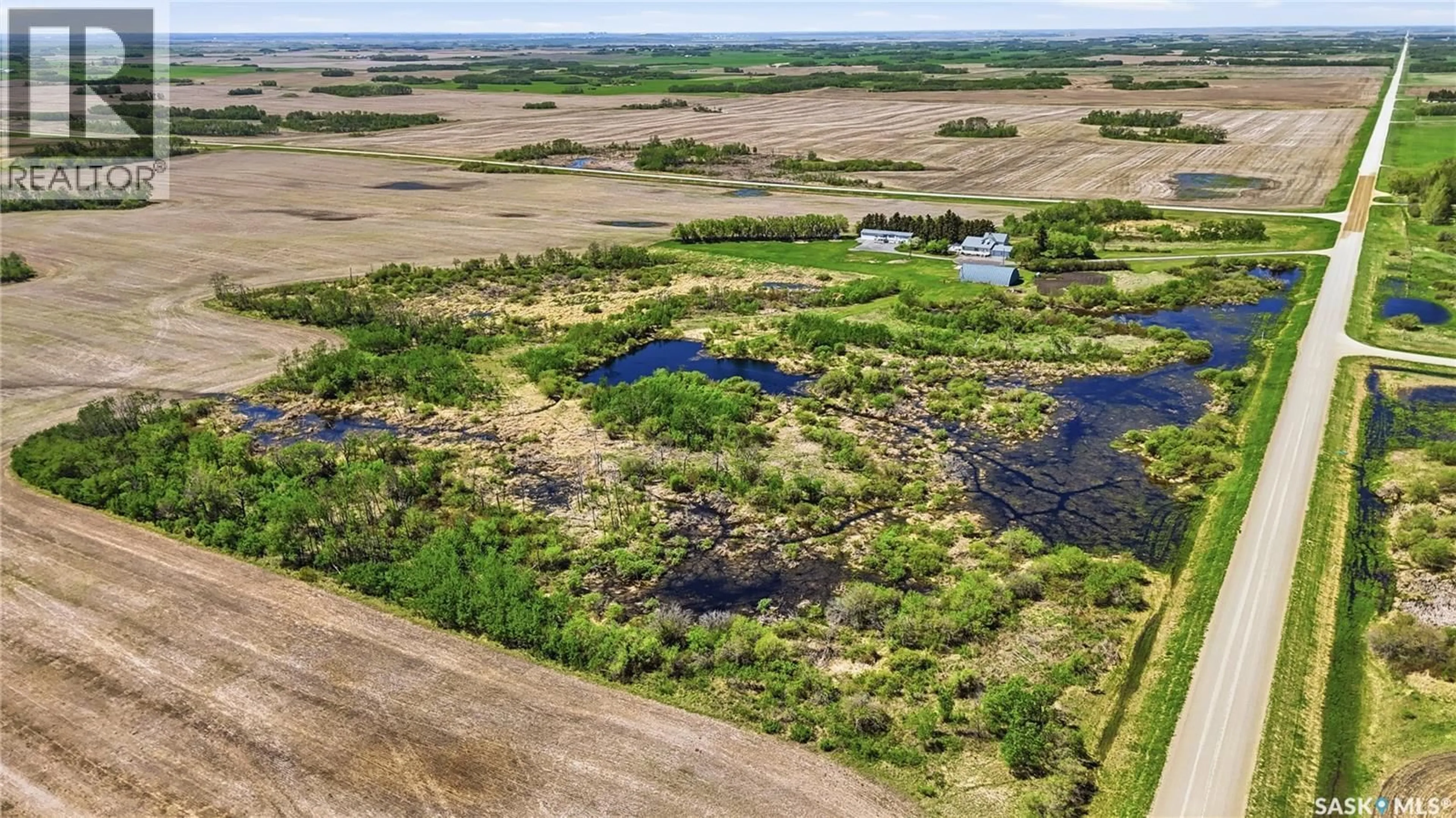 A pic from outside/outdoor area/front of a property/back of a property/a pic from drone, water/lake/river/ocean view for DONAIS ACREAGE, Edenwold Rm No.158 Saskatchewan S0G5K0