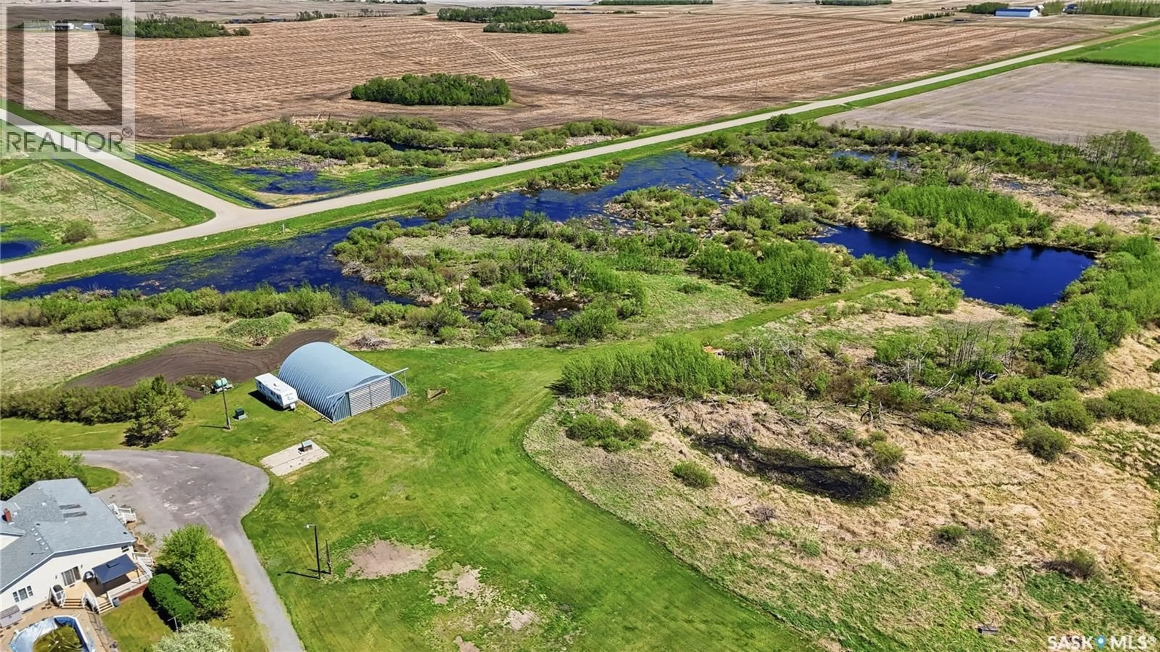 A pic from outside/outdoor area/front of a property/back of a property/a pic from drone, water/lake/river/ocean view for DONAIS ACREAGE, Edenwold Rm No.158 Saskatchewan S0G5K0