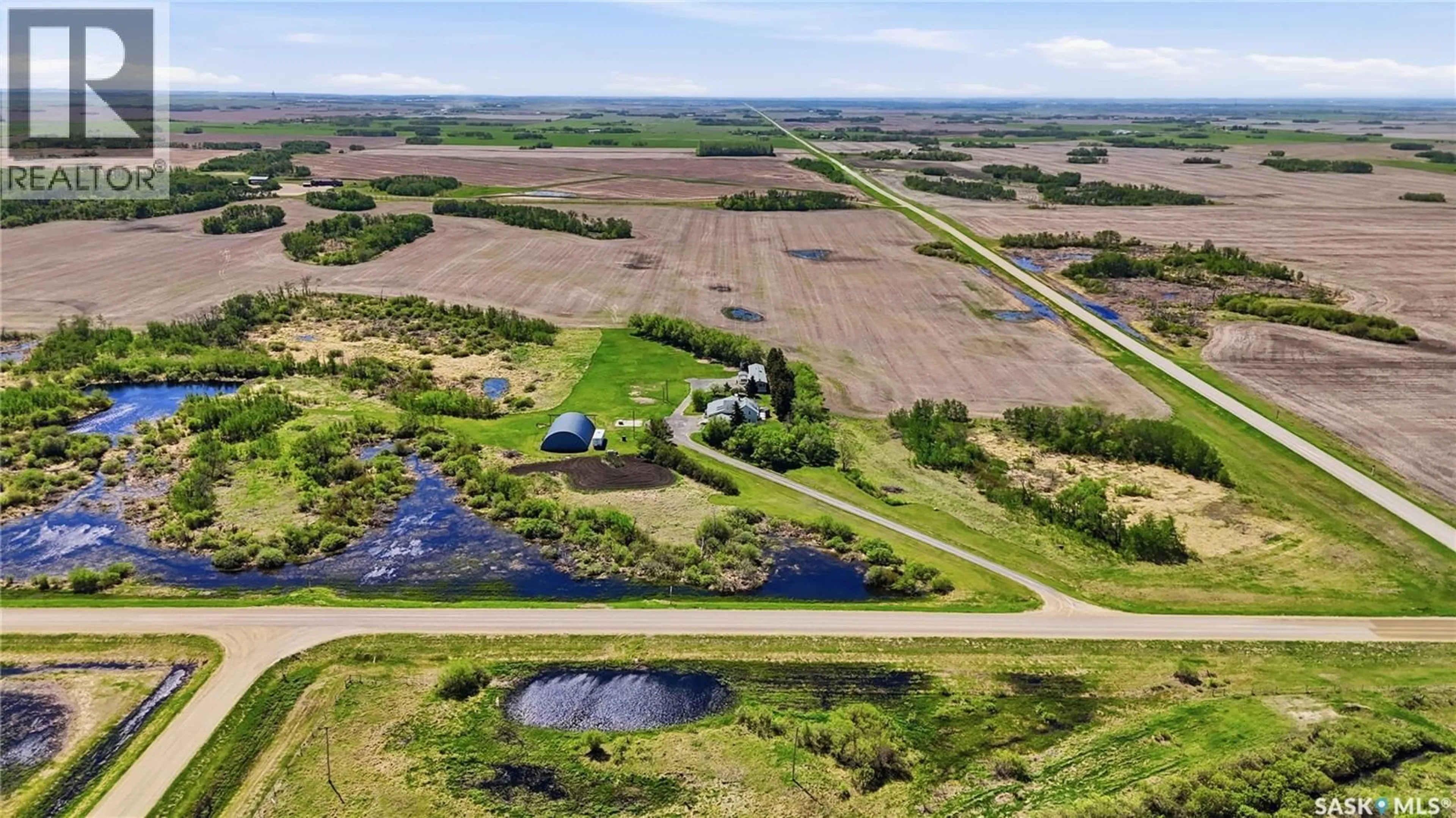A pic from outside/outdoor area/front of a property/back of a property/a pic from drone, water/lake/river/ocean view for DONAIS ACREAGE, Edenwold Rm No.158 Saskatchewan S0G5K0