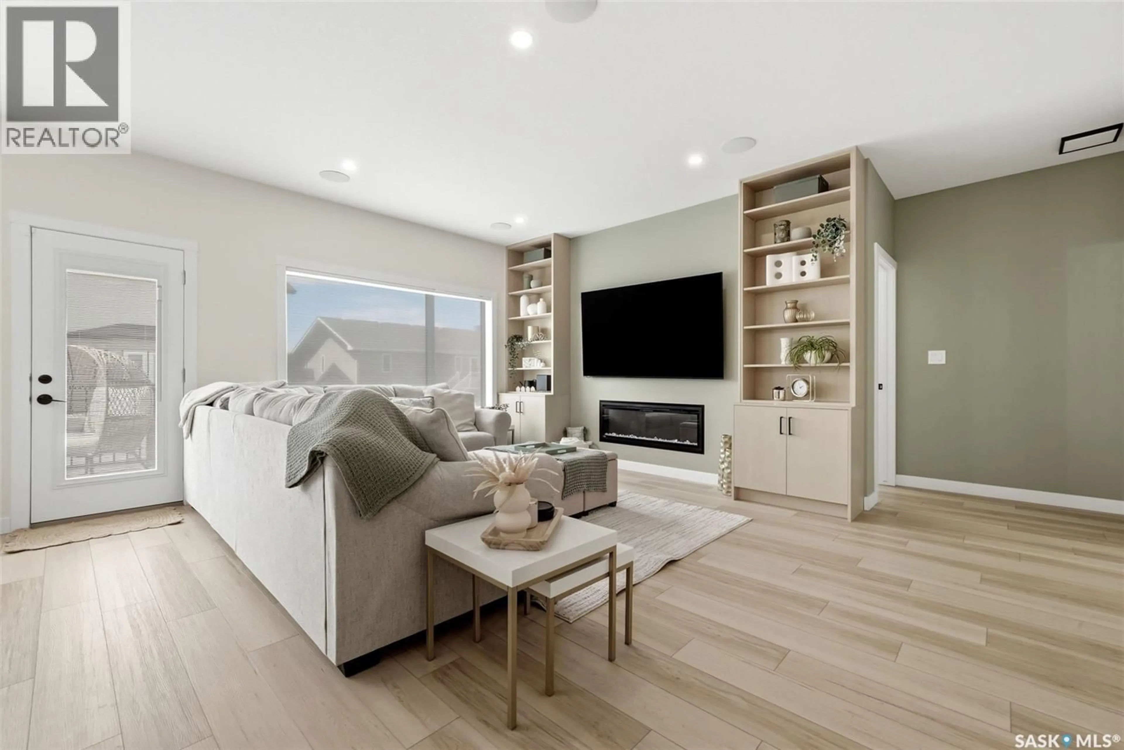 Living room with furniture, wood/laminate floor for 3318 GREEN BROOK ROAD, Regina Saskatchewan S4V1P2