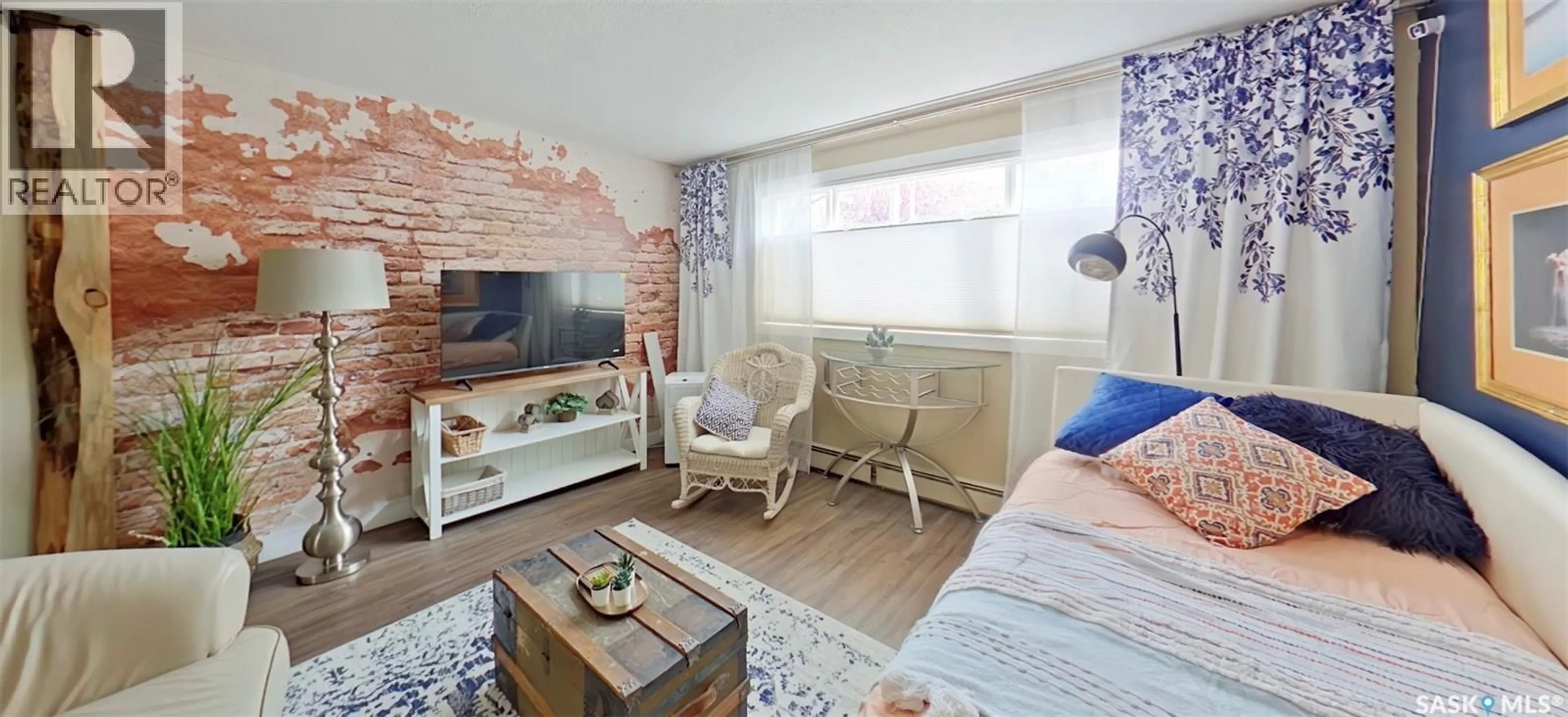 Living room with furniture, wood/laminate floor for 2 2358 RAE STREET, Regina Saskatchewan S4T2G2